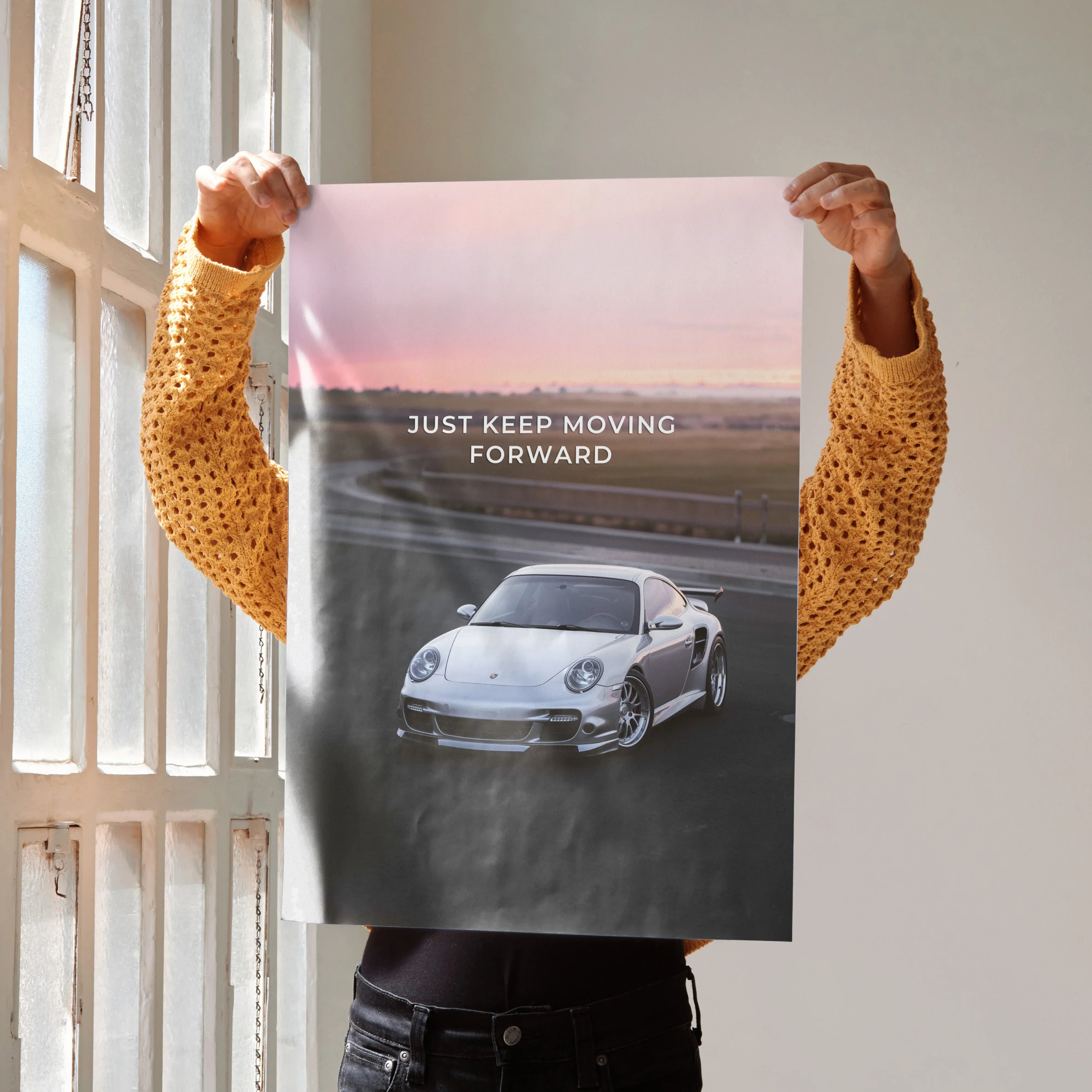 Poster wall art featuring a Porsche 911 Turbo on a road at sunrise with motivational text "Just Keep Moving Forward".
