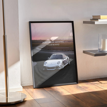 Motivational poster wall art featuring a white Porsche 911 Turbo on a racetrack with sunrise background and inspiring text.