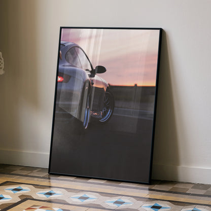 Porsche 911 Turbo poster featuring rear side view against sunset, luxury car wall art.