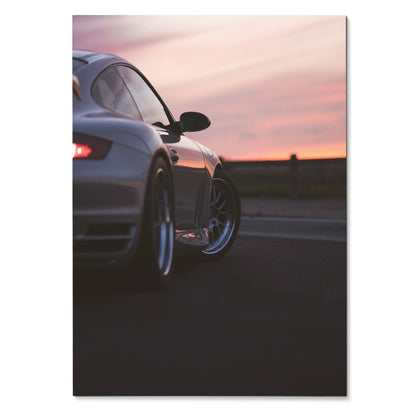 Porsche 911 Turbo rear view in sunset with sleek curves poster wall art.