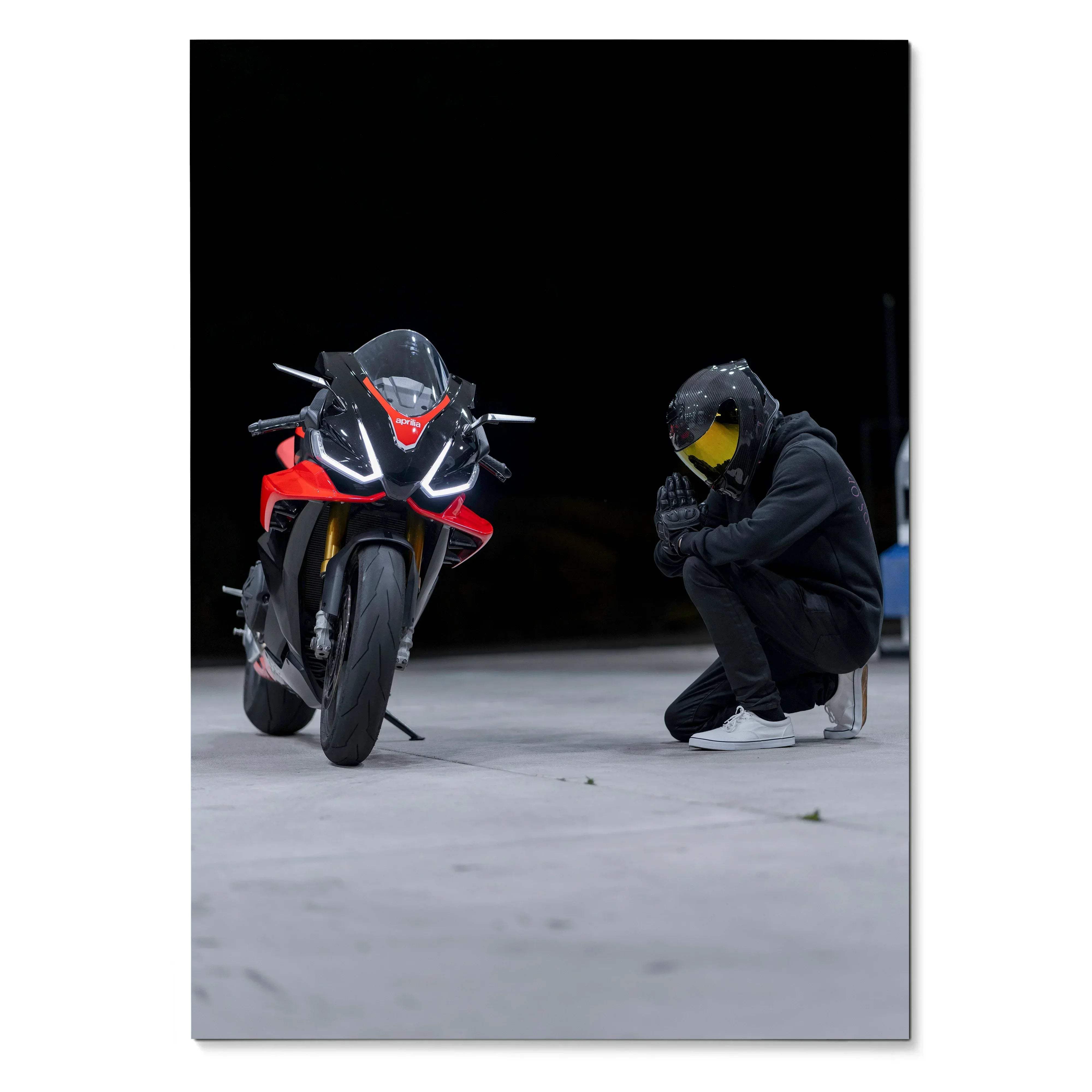 Red and black Aprilia RSV4 motorcycle with sleek aerodynamic design and glowing white LED headlights in biker poster