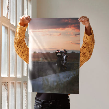 Aprilia RSV4 1100 Factory motorcycle poster with sunset background wall art in warm tones.