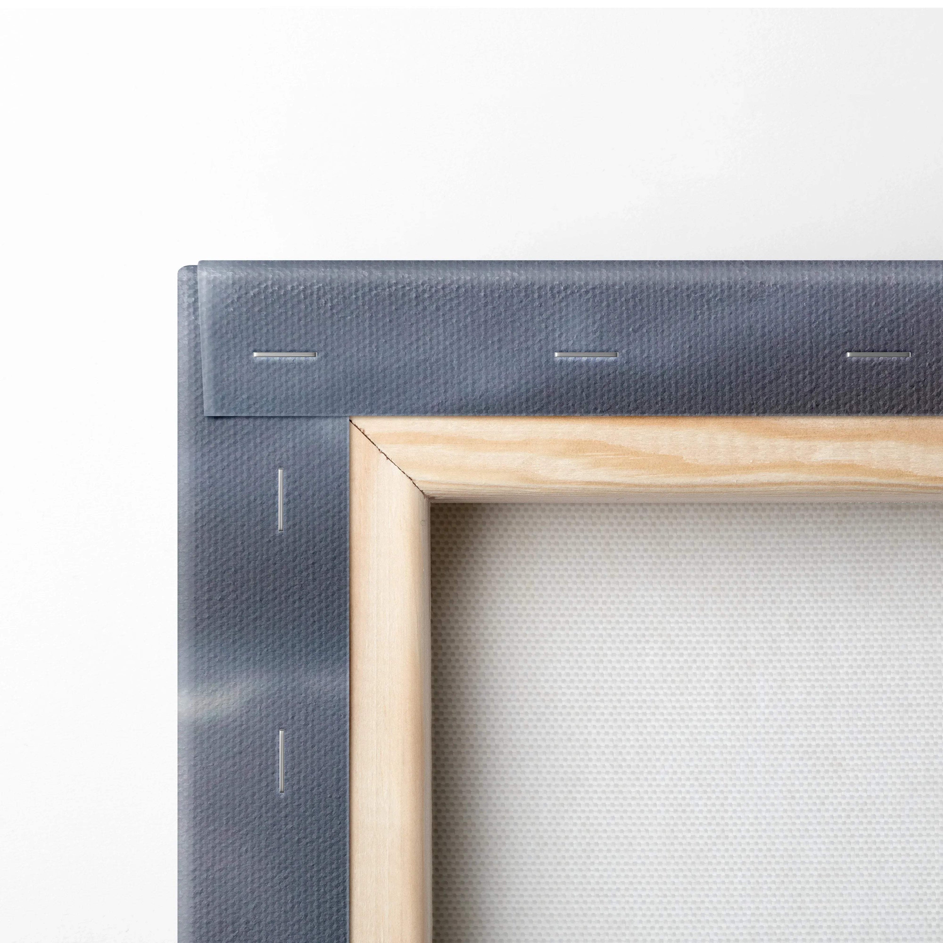 Close-up of wooden stretcher bars and canvas fabric edge on vertical wall art canvas print.