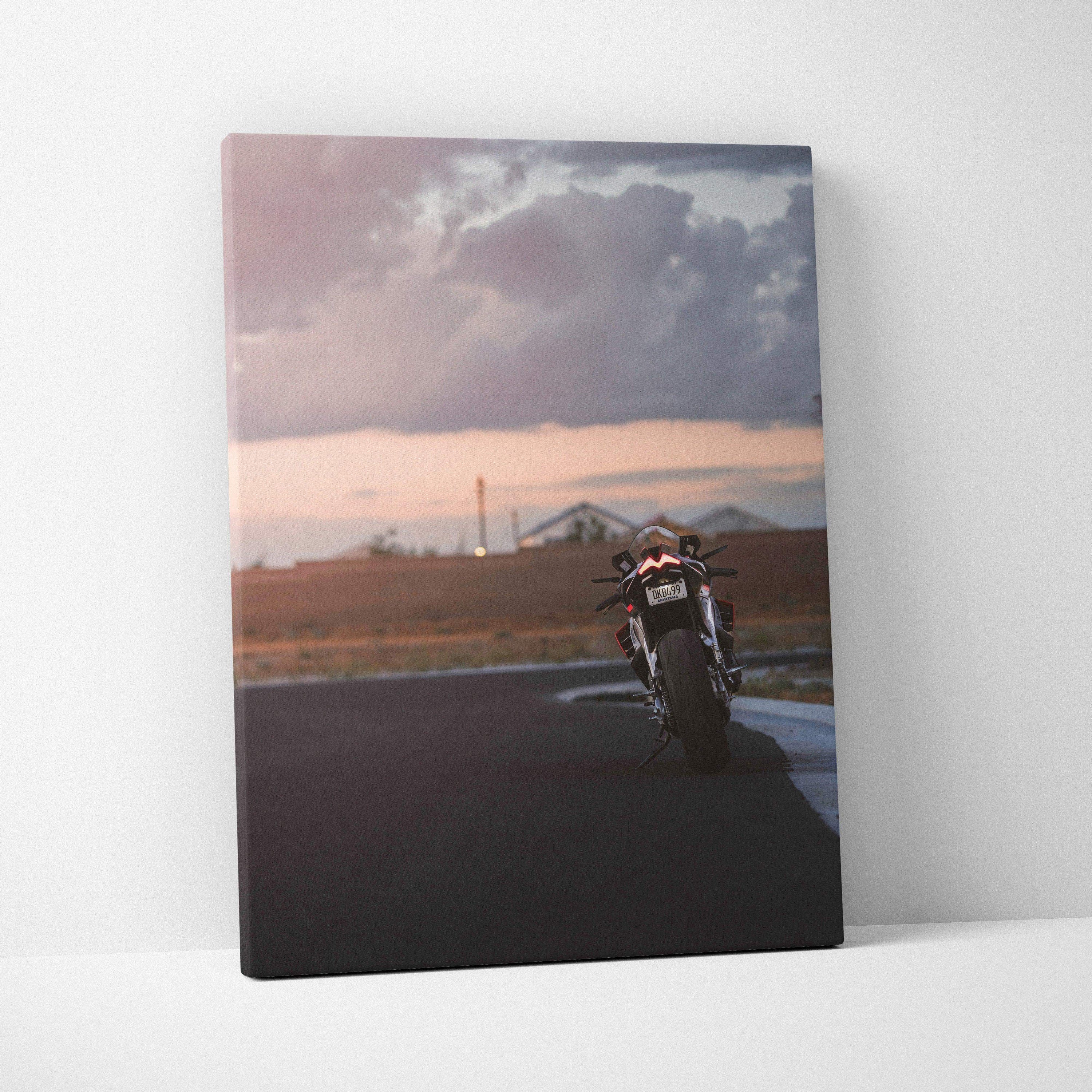 Aprilia RSV4 1100 Factory motorcycle canvas art with sunset and cloudy sky wall art.