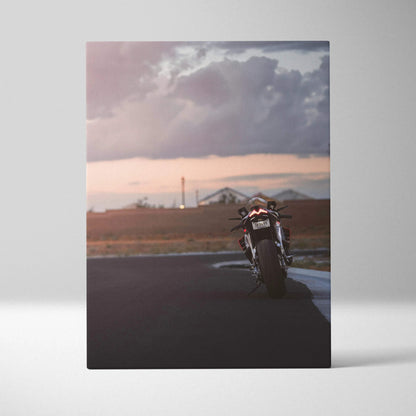 Aprilia RSV4 1100 Factory motorcycle canvas art with moody sunset sky and road scene.