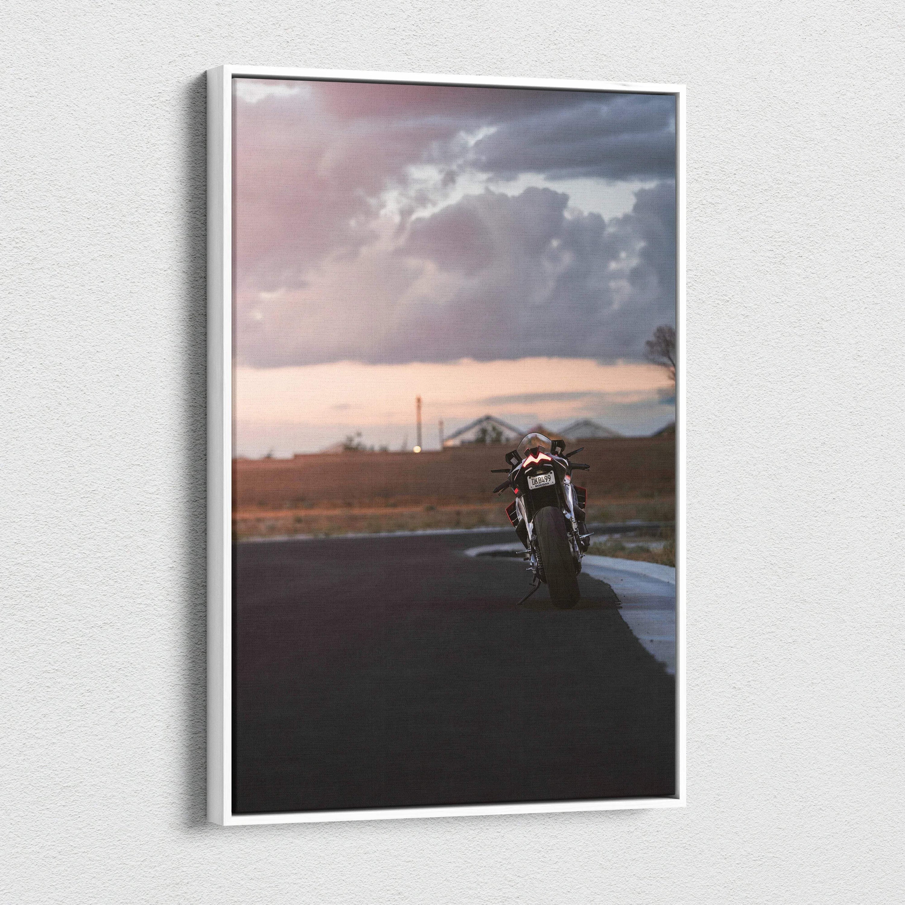 Vertical canvas wall art featuring Aprilia RSV4 1100 Factory motorcycle on open road at sunset.