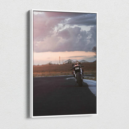 Vertical canvas wall art featuring Aprilia RSV4 1100 Factory motorcycle on open road at sunset.