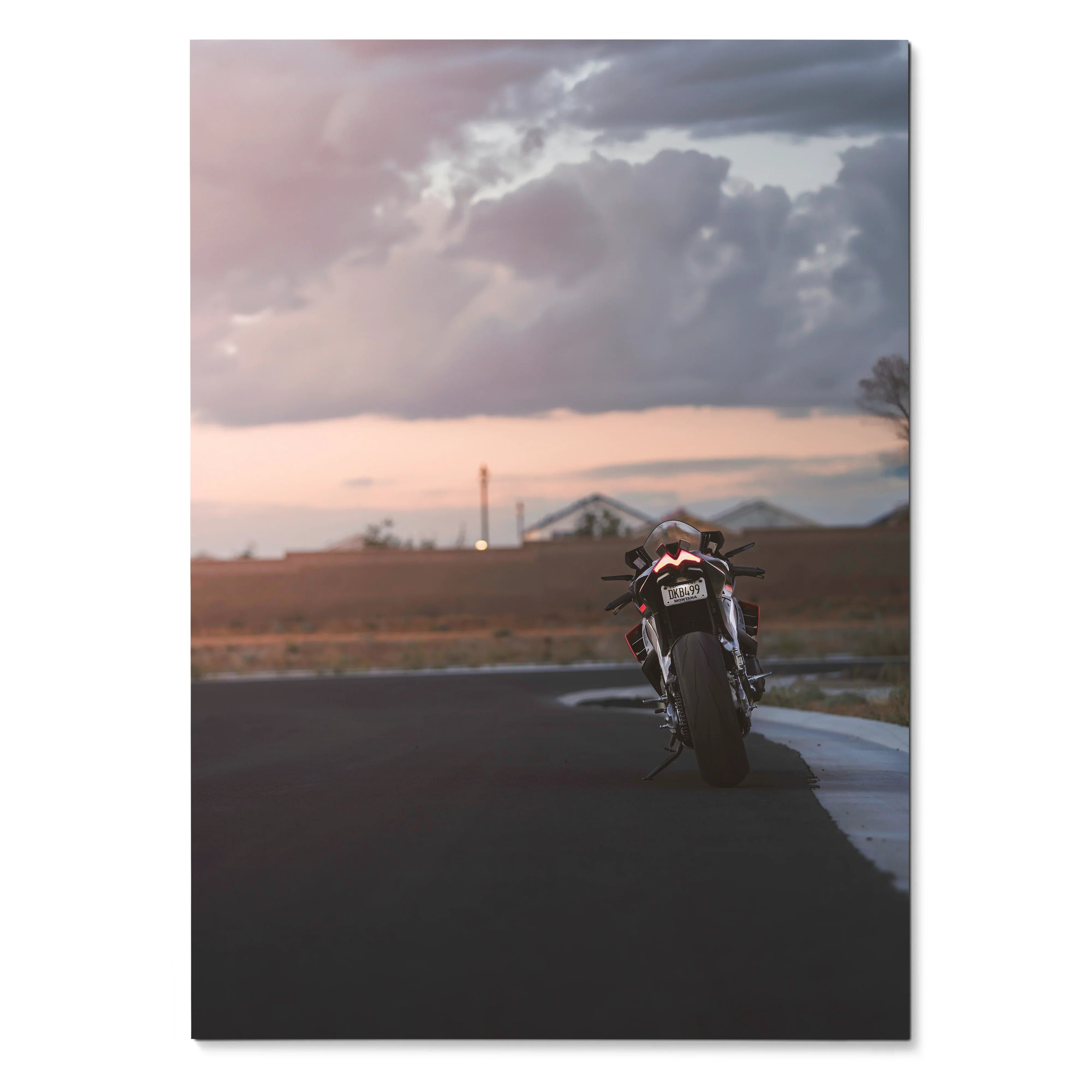 Aprilia RSV4 1100 Factory motorcycle parked on road at sunset poster wall art.