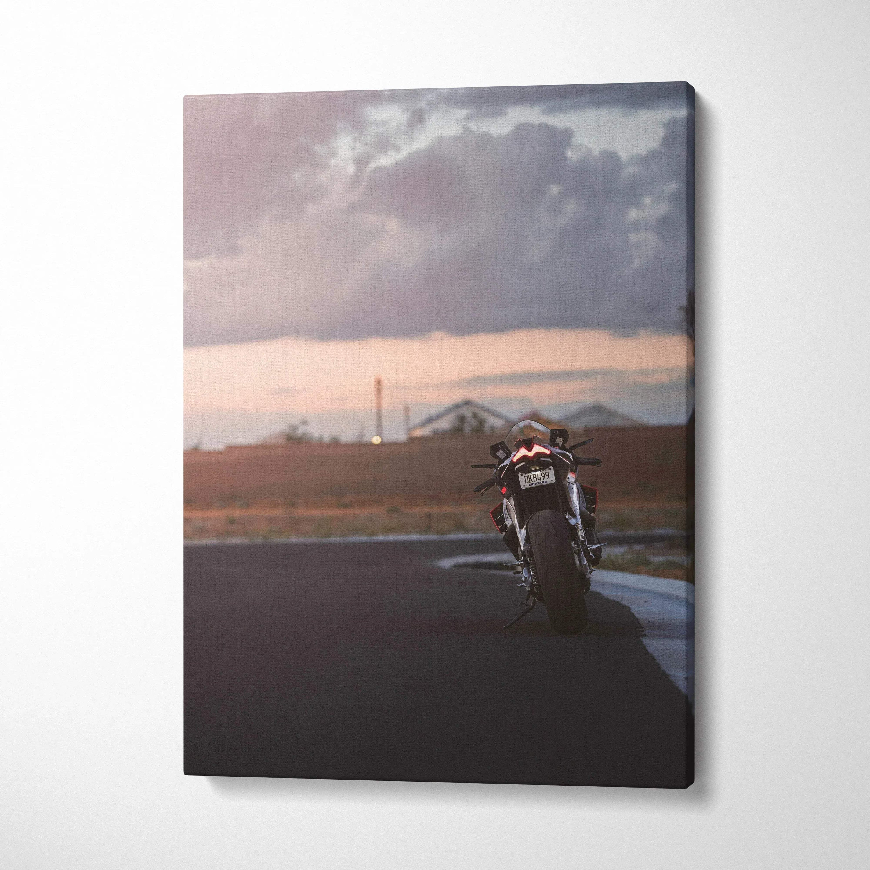 Aprilia RSV4 1100 Factory motorcycle on road at sunset canvas wall art.
