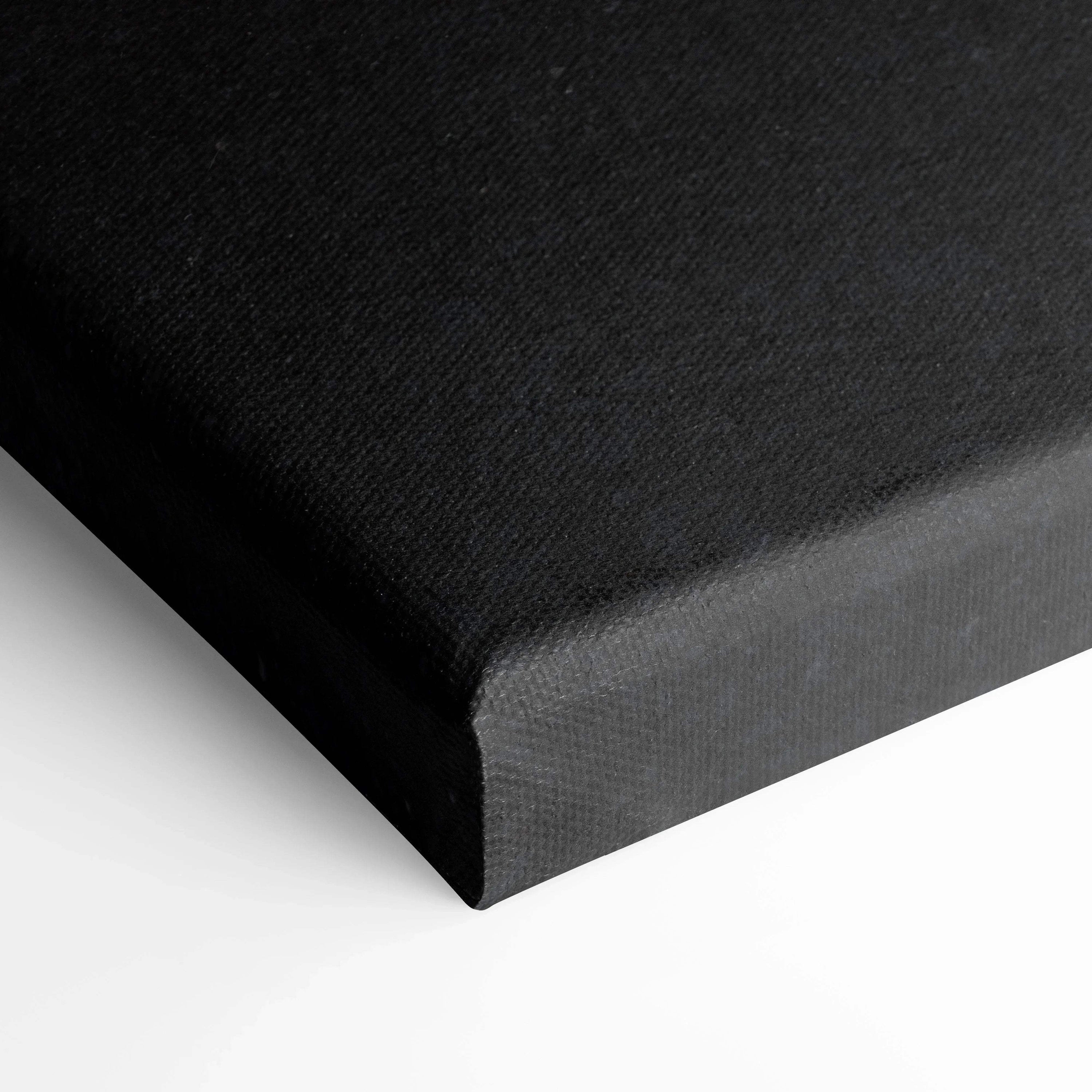Black wrapped edge canvas wall art with textured surface and clean corners.