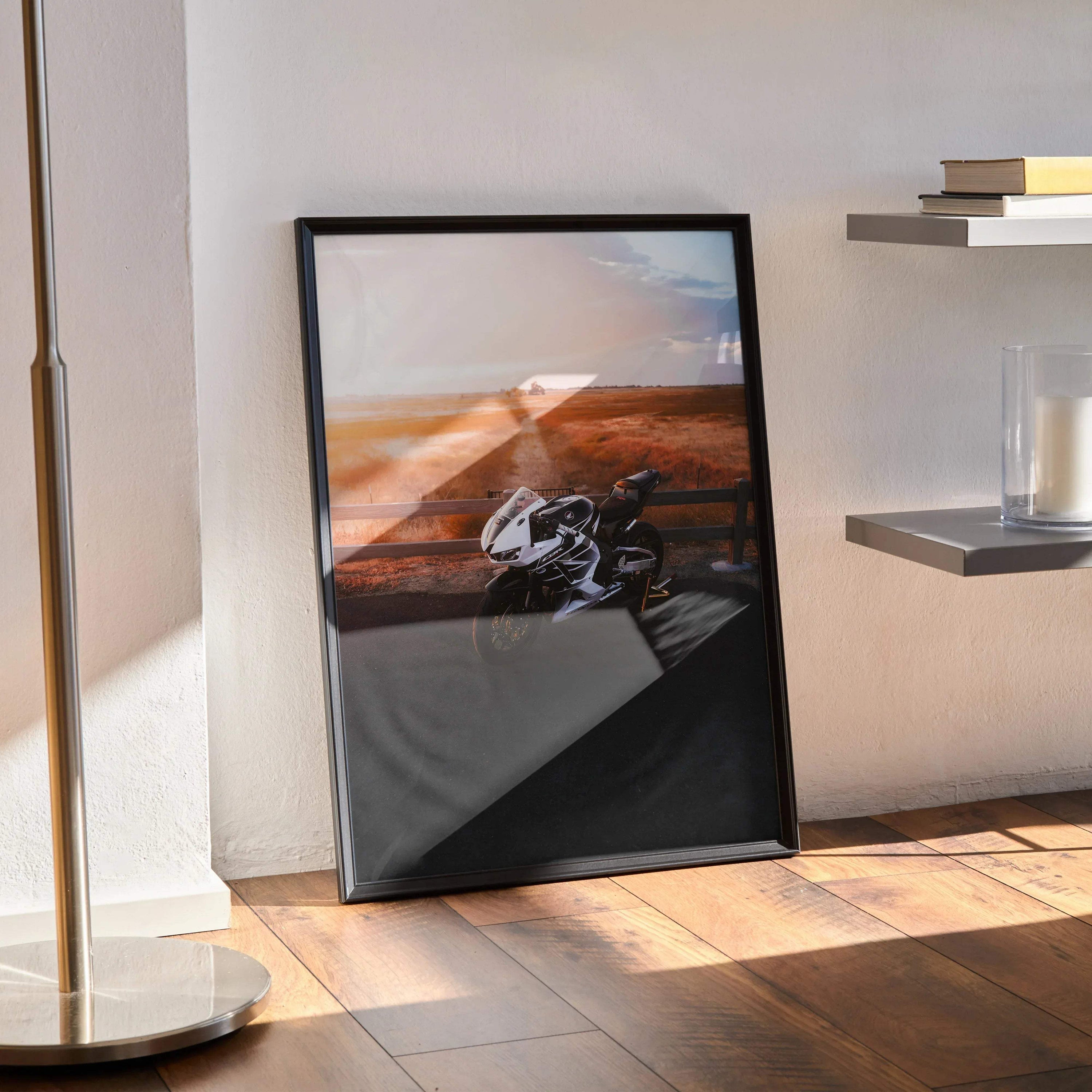 Honda CBR600RR motorcycle poster leaning against a wall with black frame, modern wall art.