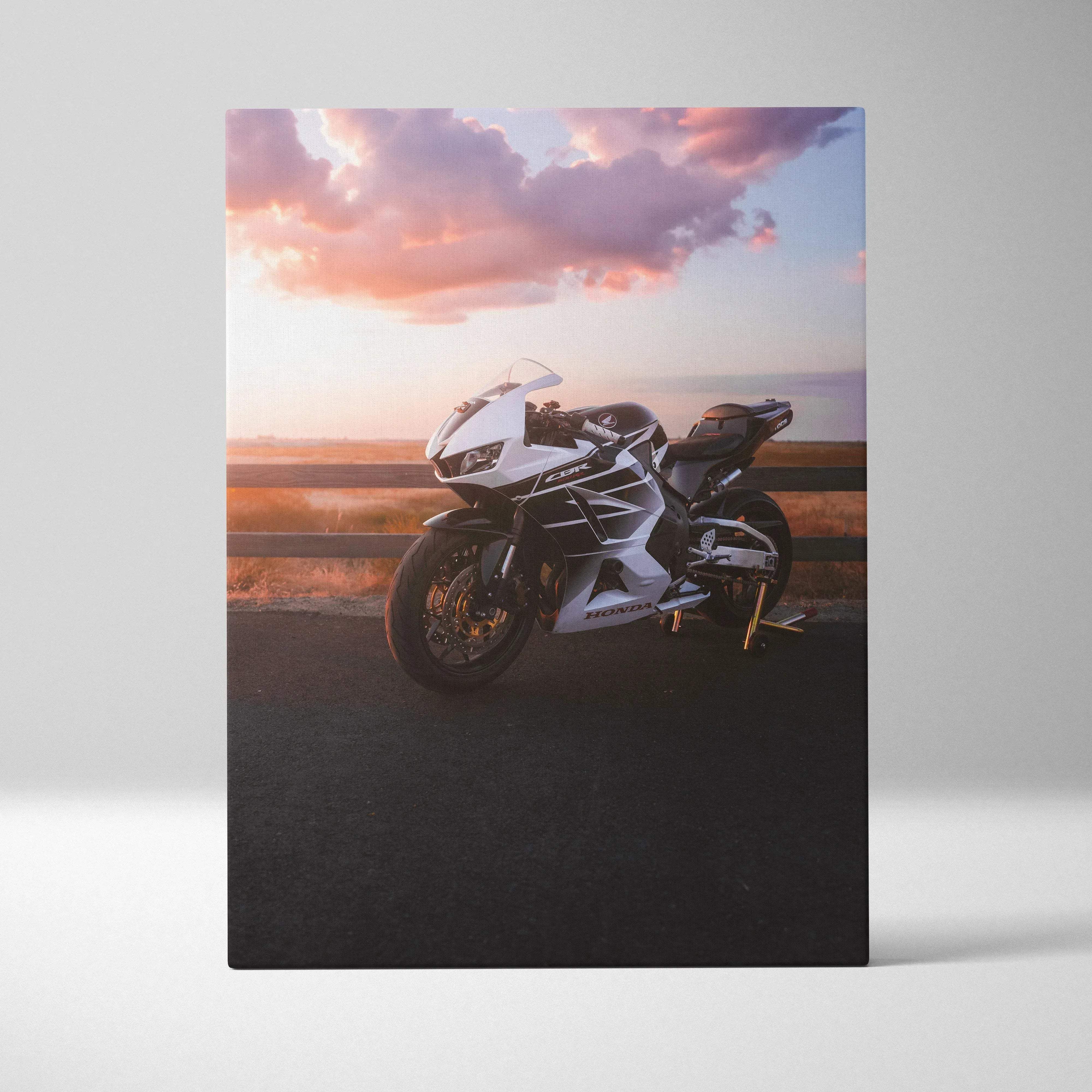 White and black Honda CBR600RR motorcycle canvas print with sleek aerodynamic design against a sunset backdrop