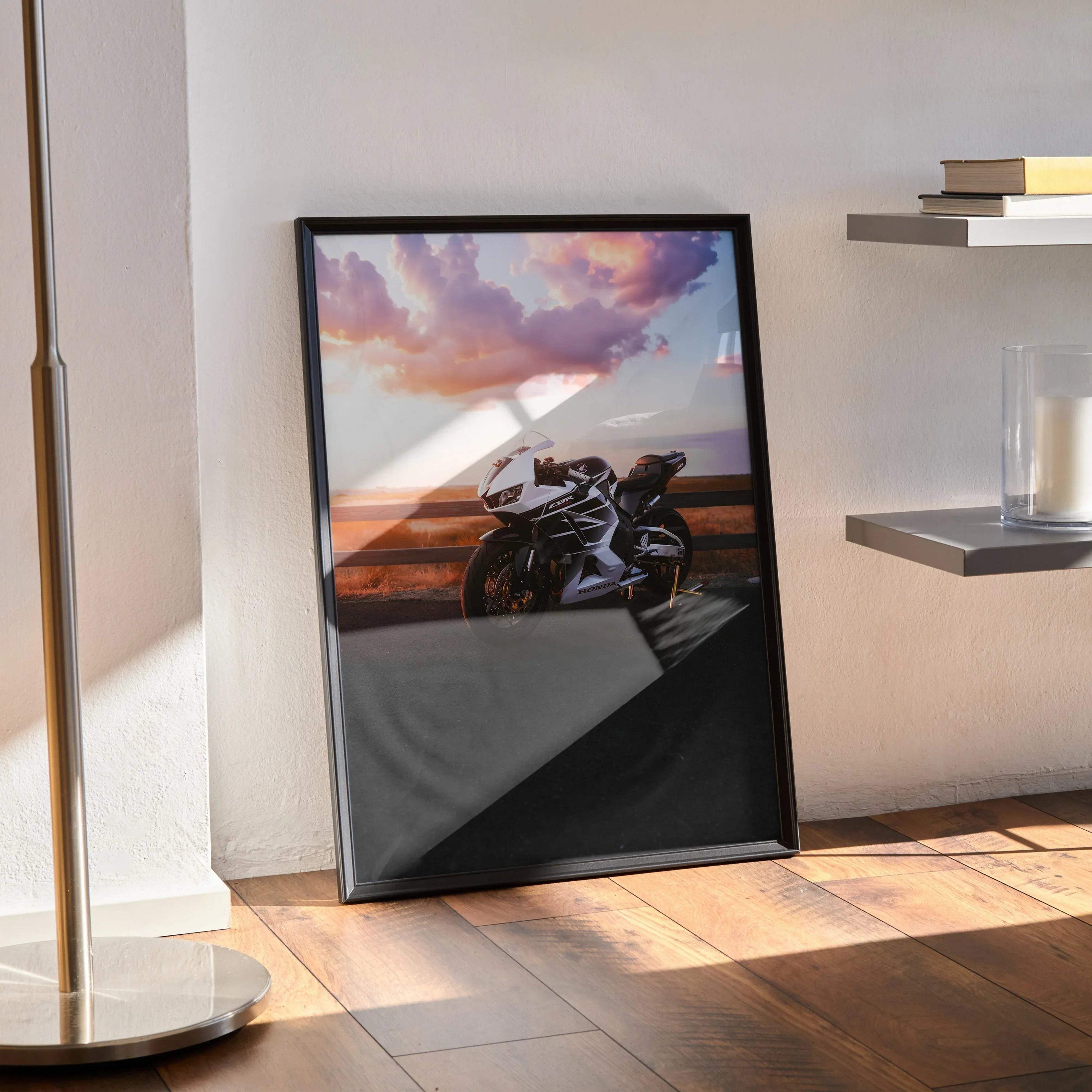 Honda CBR600RR motorcycle poster with sunset backdrop displayed as sleek wall art in black frame.