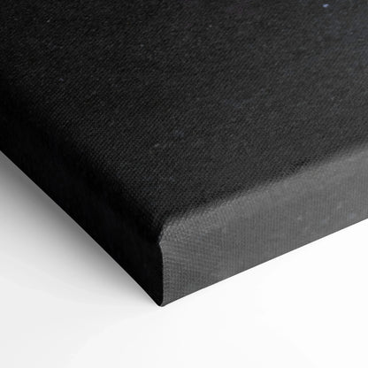 Black stretched canvas corner showing texture and clean edges for wall art display.