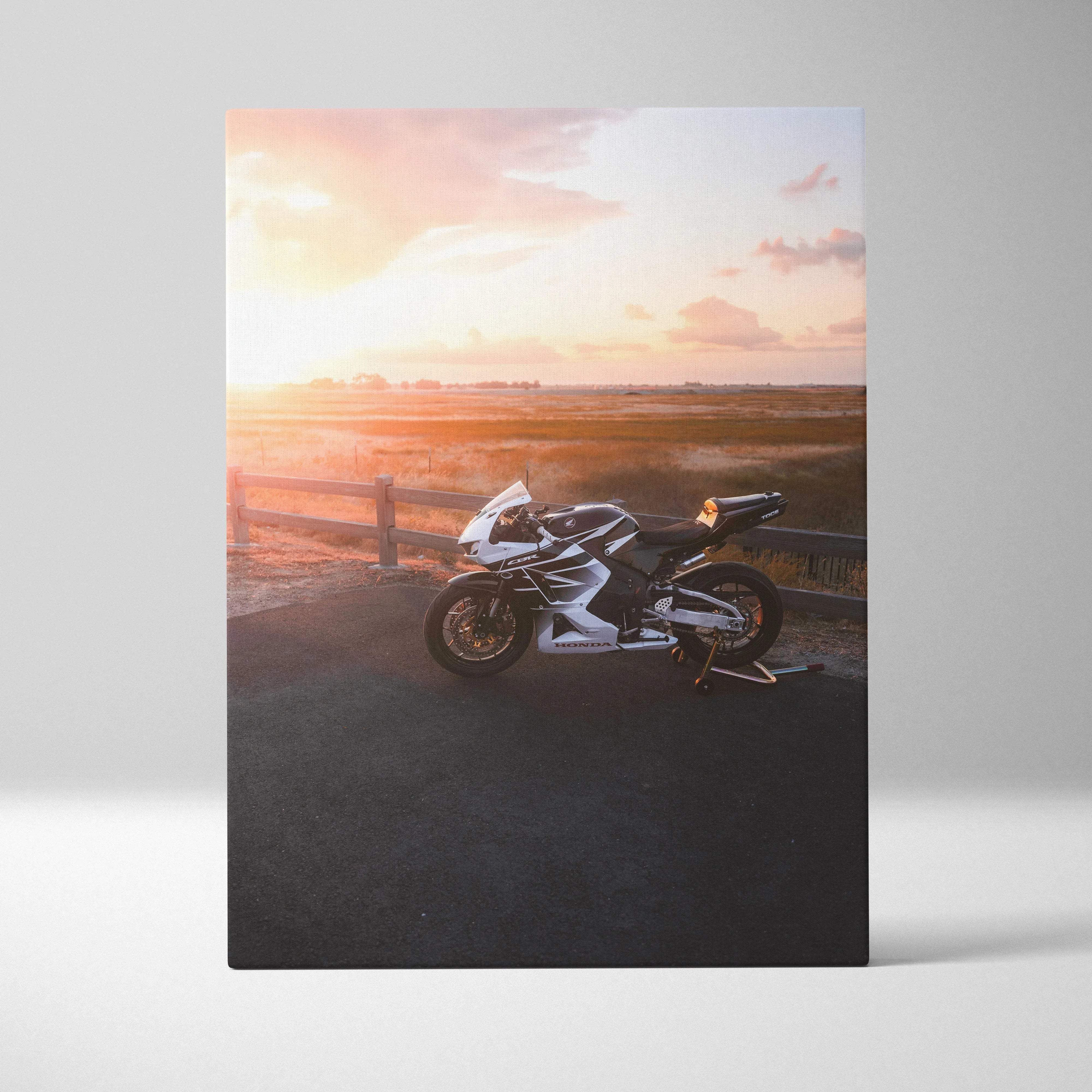 Canvas wall art featuring a white and black honda cbr600rr sport motorcycle with sleek design parked at sunset