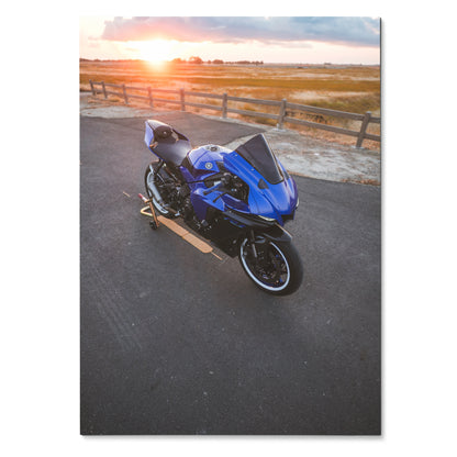 Blue Yamaha R1 motorcycle on road at sunset poster wall art.