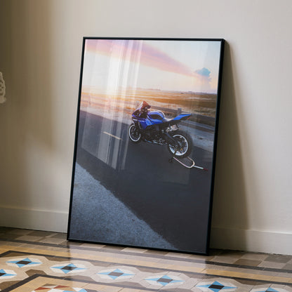 Yamaha YZF-R1 motorcycle poster with sunset background leaning against wall, sleek black frame wall art.