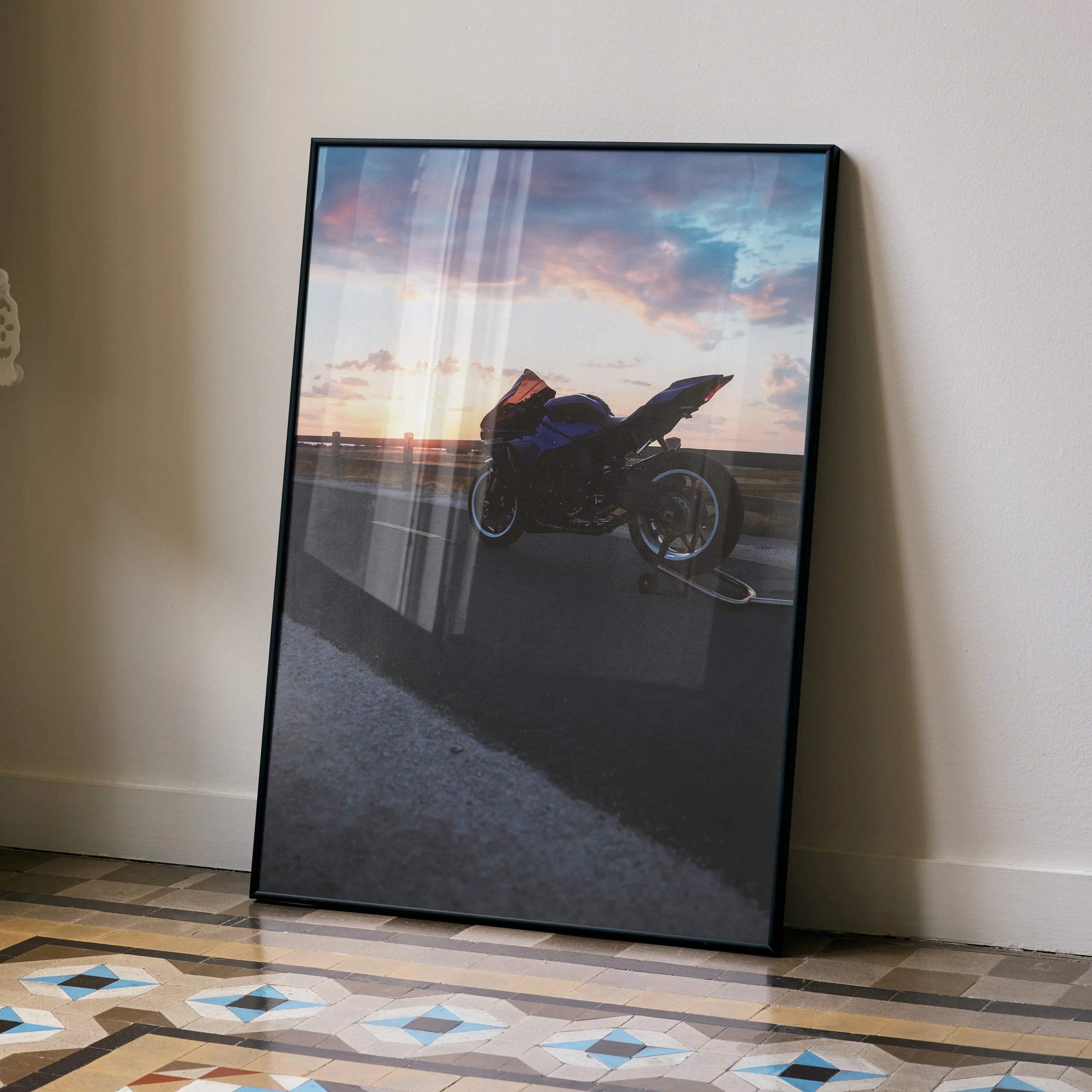 Yamaha R1 motorcycle poster with sunset background, sleek black wall art in modern frame.