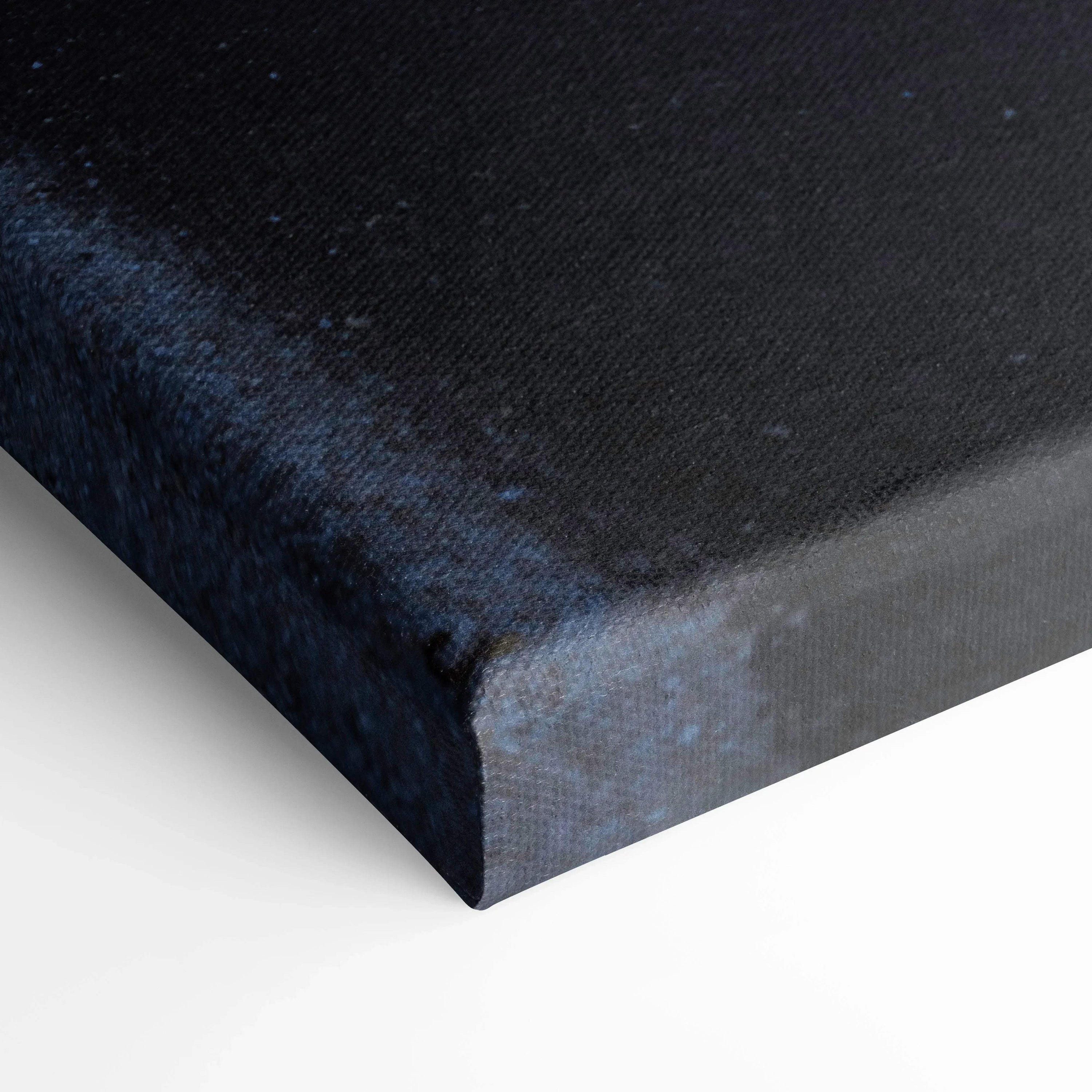 Close-up of black textured canvas corner showing premium wall art material and print quality.