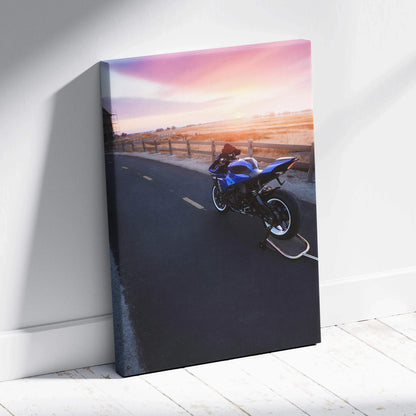 Yamaha R1 motorcycle at sunset on curved road printed on vertical canvas wall art.