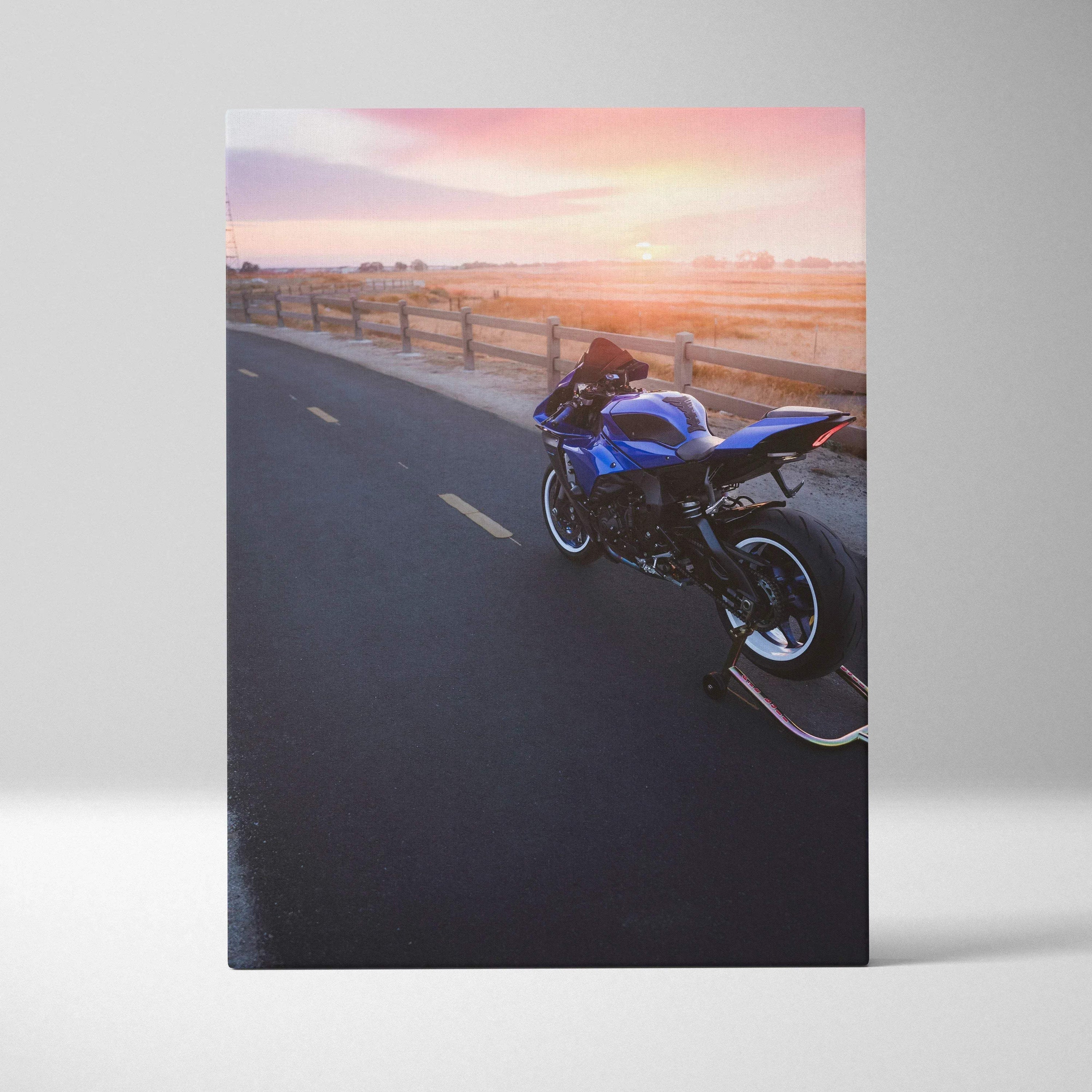 Blue Yamaha R1 motorcycle parked on road at sunset canvas wall art print.
