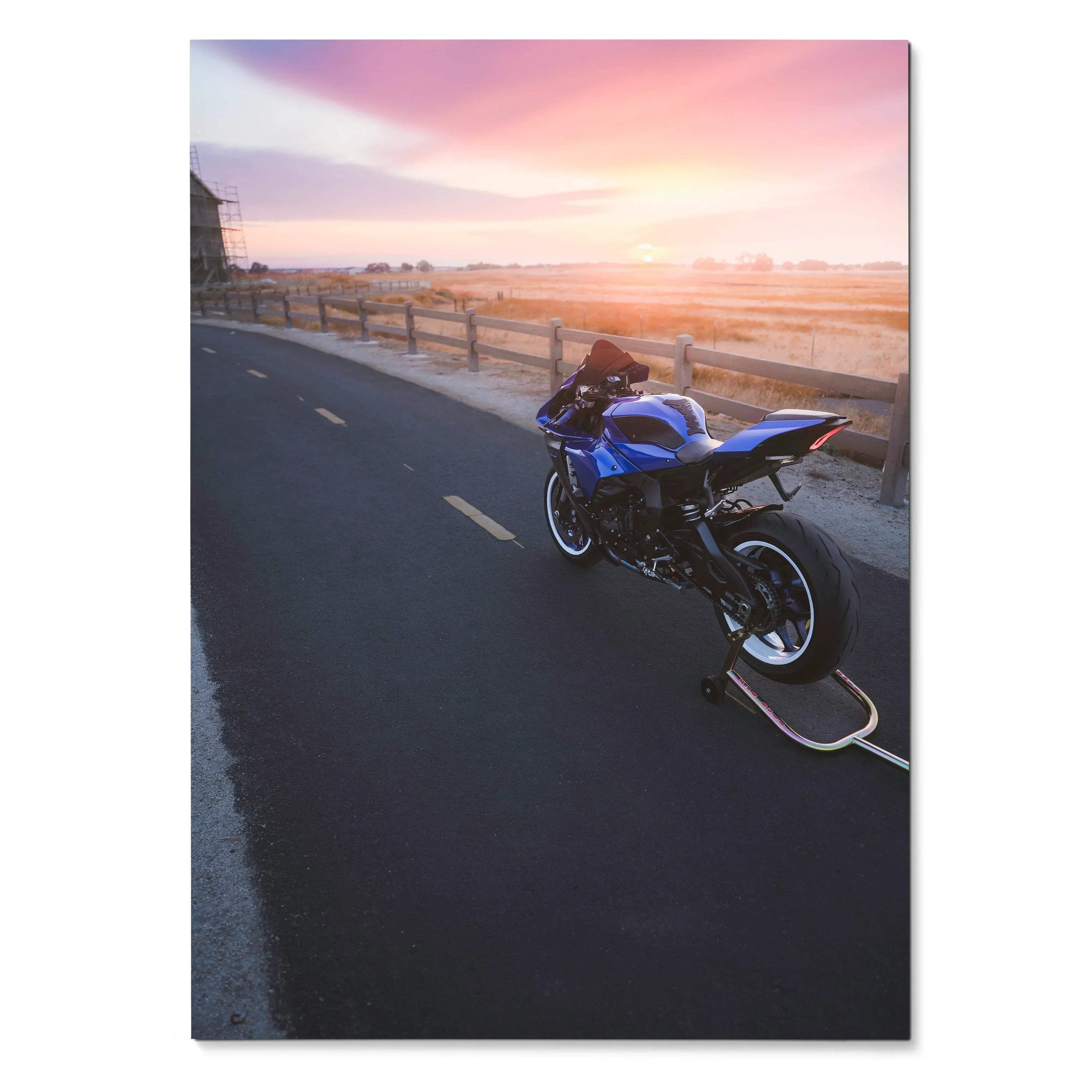 Yamaha R1 motorcycle parked on sunset beach road poster wall art with vibrant sky.