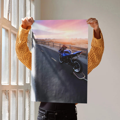 Yamaha R1 motorcycle on road at sunset poster wall art with pink and orange sky.