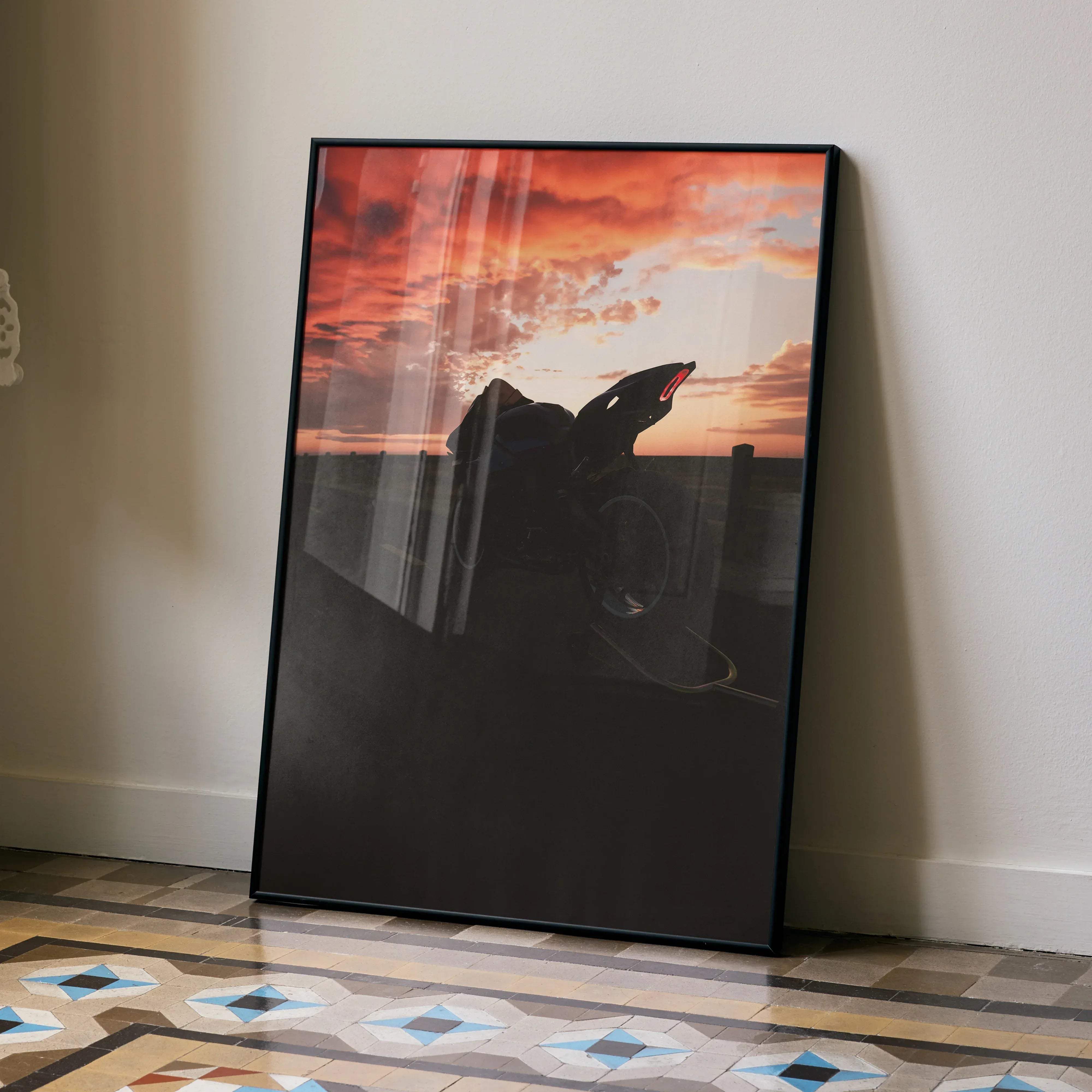 Black-framed yamaha r1 motorcycle art print featuring a silhouette against an orange and pink sunset sky