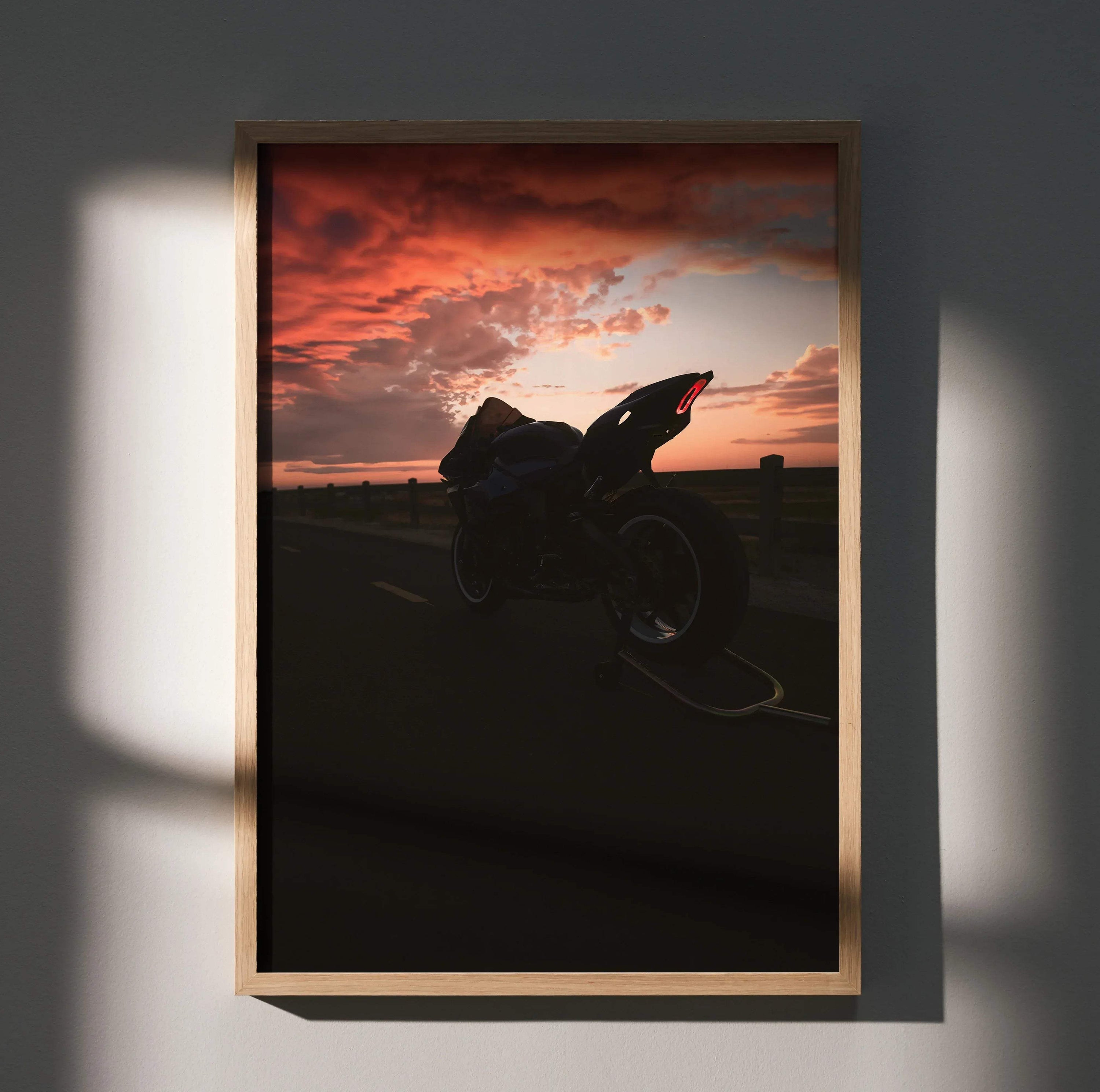 Yamaha R1 motorcycle silhouette at sunset poster wall art with vibrant orange sky.
