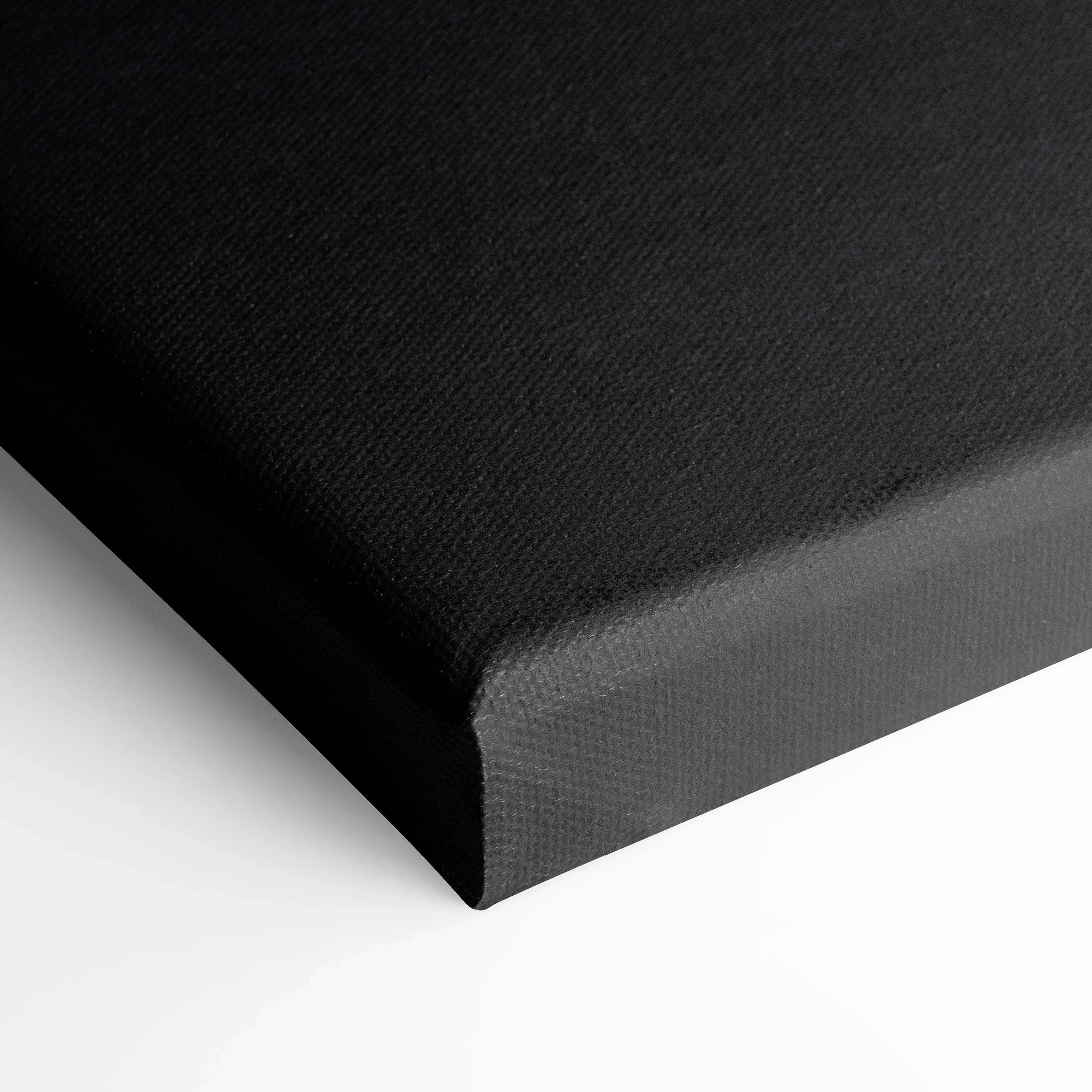 Black gallery-wrapped canvas corner with fine textured surface for wall art display.
