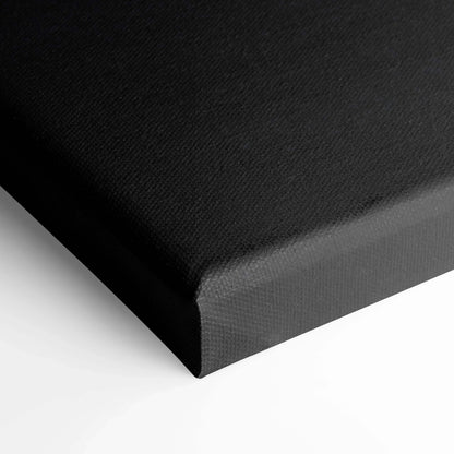 Black gallery-wrapped canvas corner with fine textured surface for wall art display.