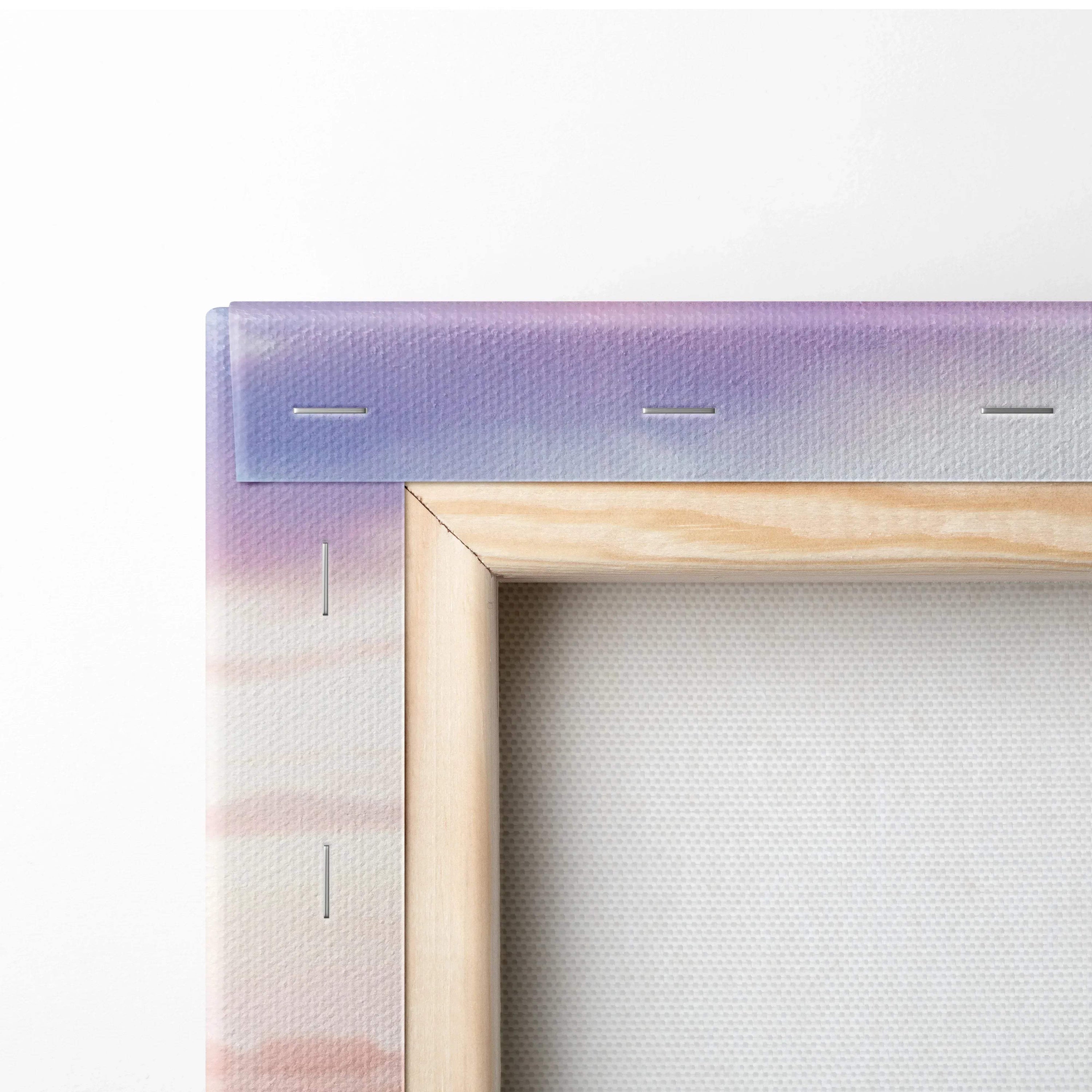 Close-up of wooden stretcher and stapled edge on vertical canvas art with soft purple and beige gradient wall art background.