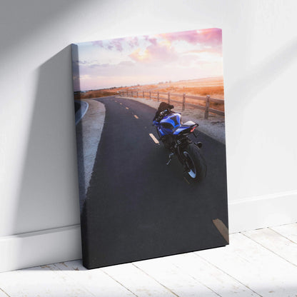 Yamaha R1 motorcycle on scenic sunset road vertical canvas wall art with warm sky tones.