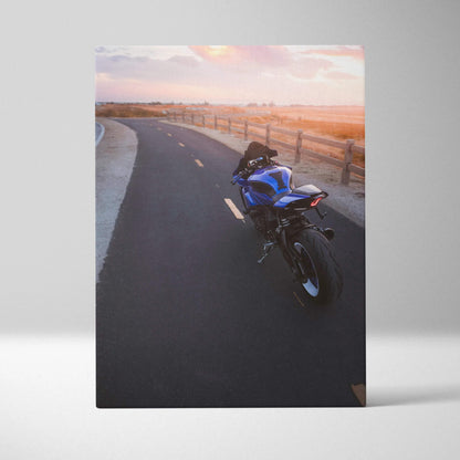Yamaha R1 motorcycle on road at sunset canvas wall art with warm sky colors.