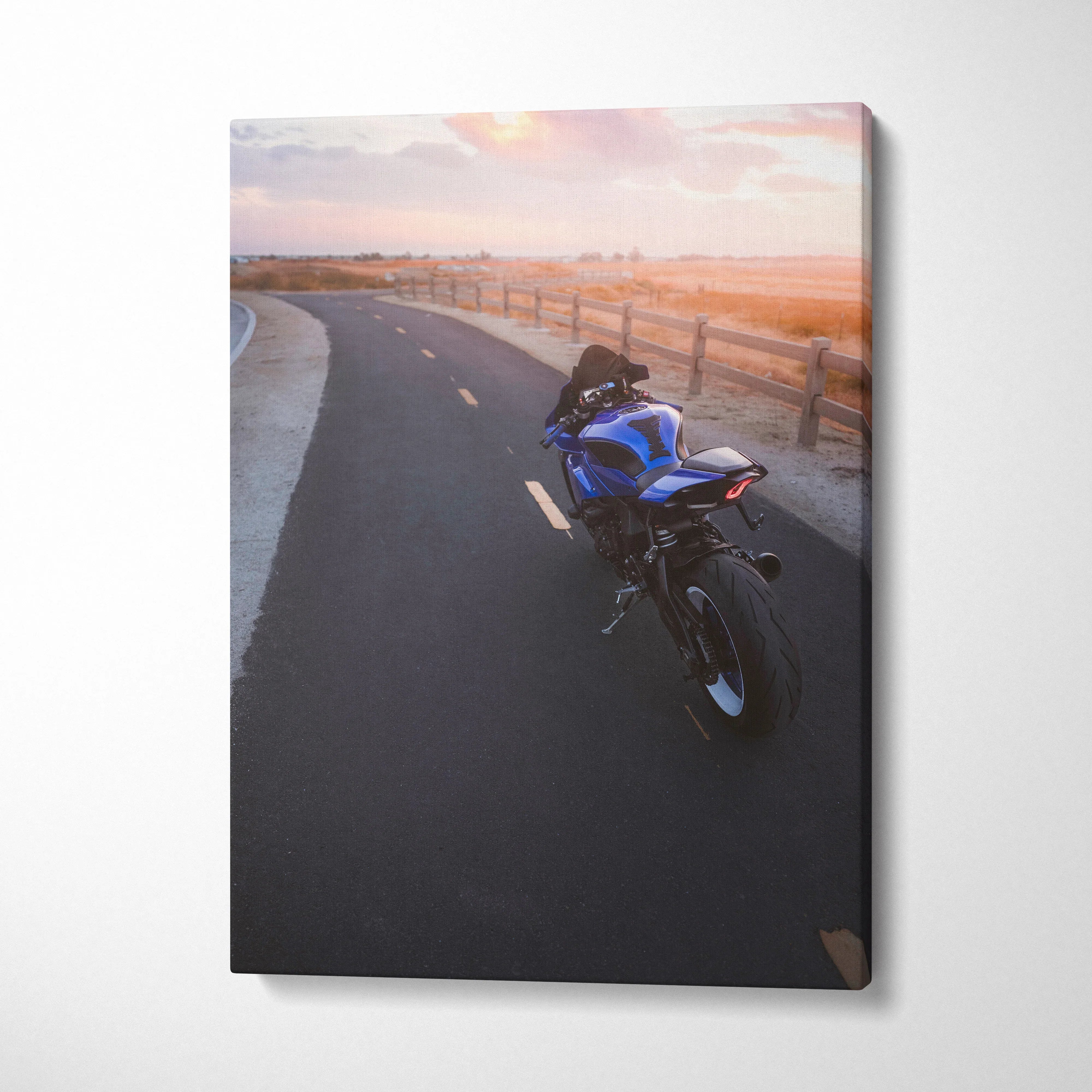 Yamaha R1 motorcycle on sunset road vertical canvas wall art with vibrant colors.