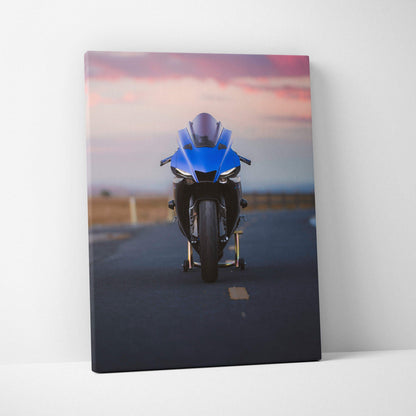 Yamaha R1 motorcycle front view on road at sunset canvas wall art with vibrant colors.
