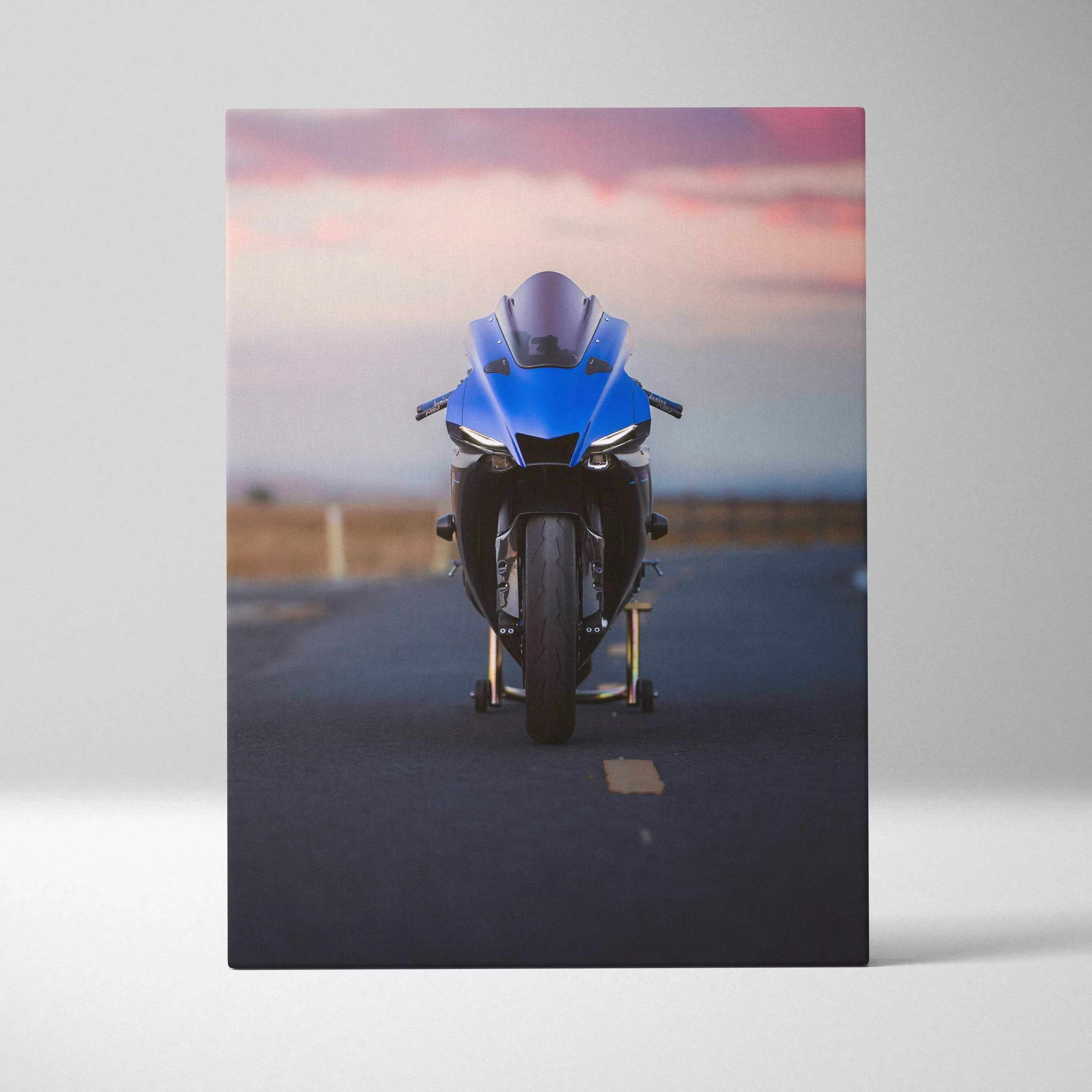 Blue Yamaha R1 motorcycle against sunset sky on canvas wall art with vertical layout.