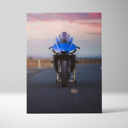 Blue Yamaha R1 motorcycle against sunset sky on canvas wall art with vertical layout.