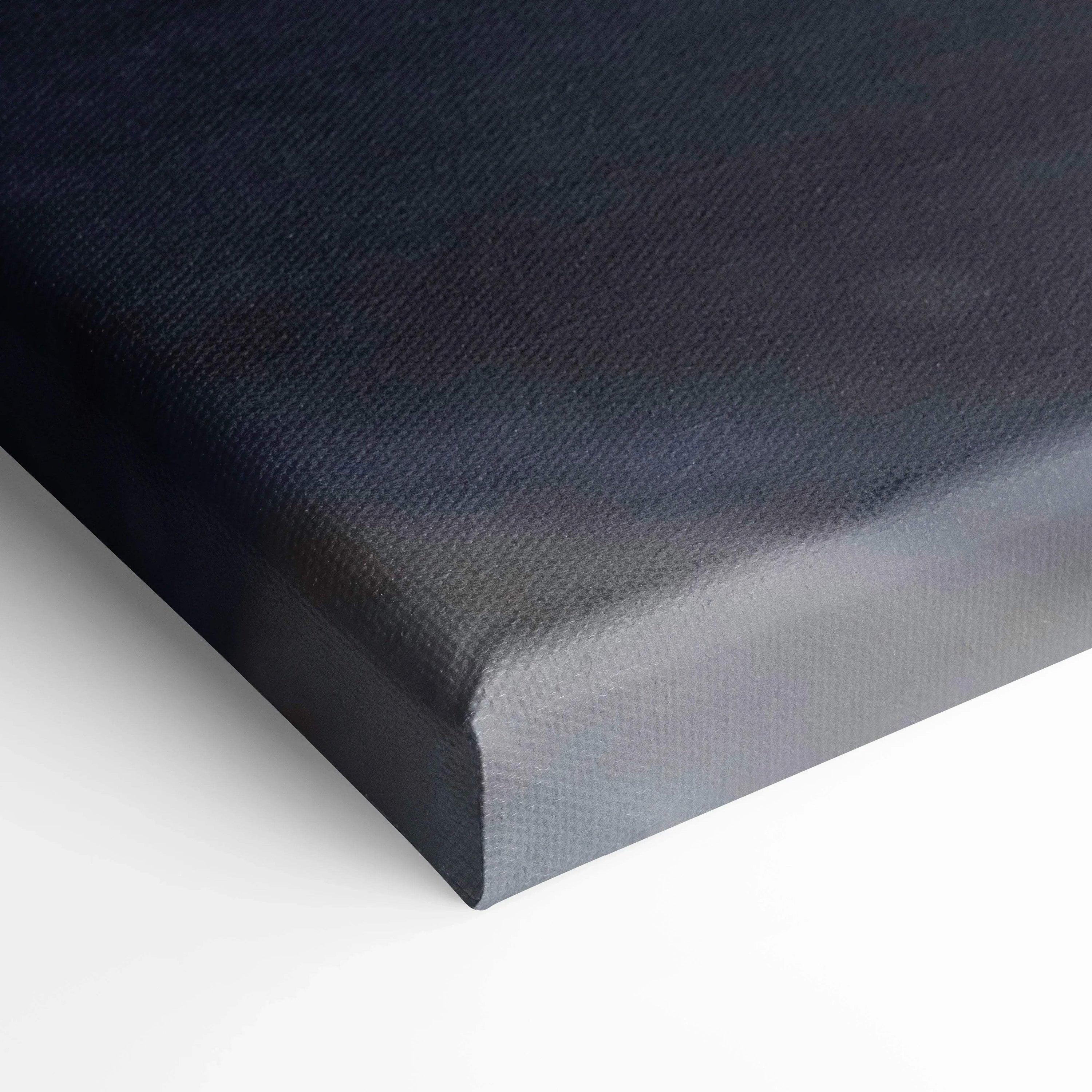 Close-up of textured black canvas corner showcasing premium wall art material and quality finish.