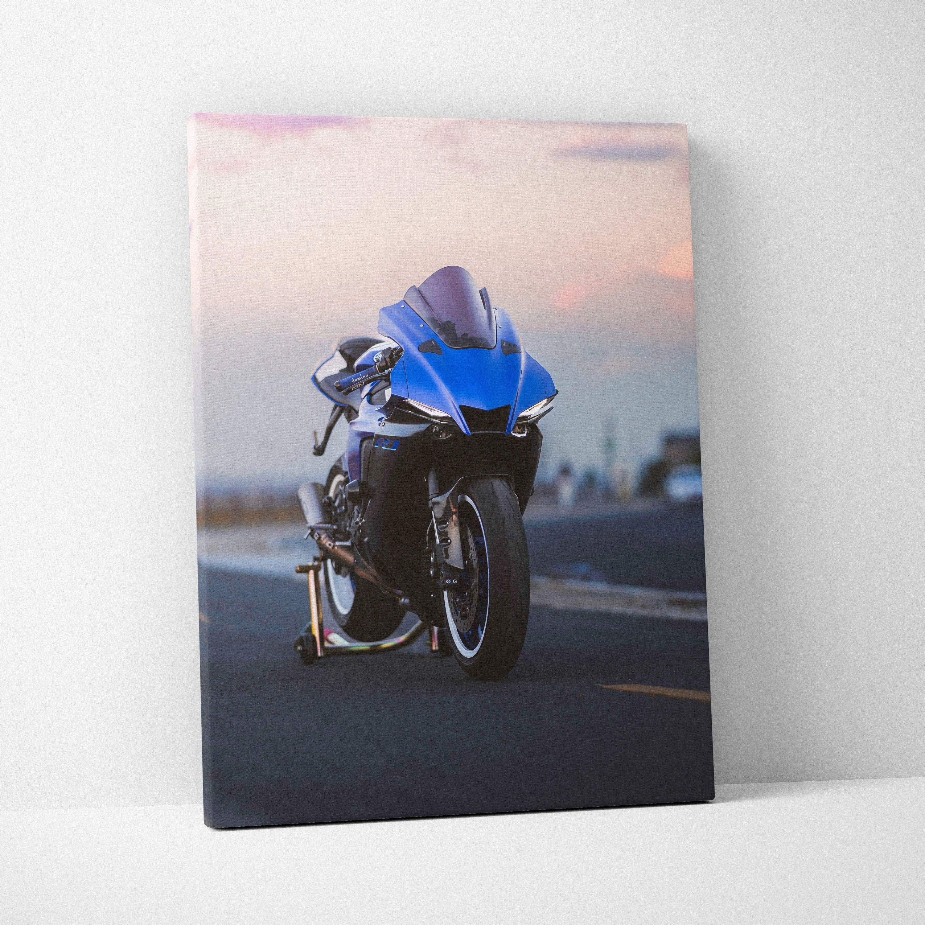 Vertical canvas wall art featuring a blue Yamaha R1 motorcycle at sunset on an open road.