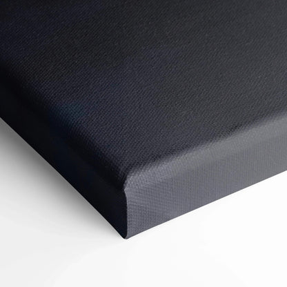 Close-up of black stretched canvas edge showcasing textured canvas art for wall decor.