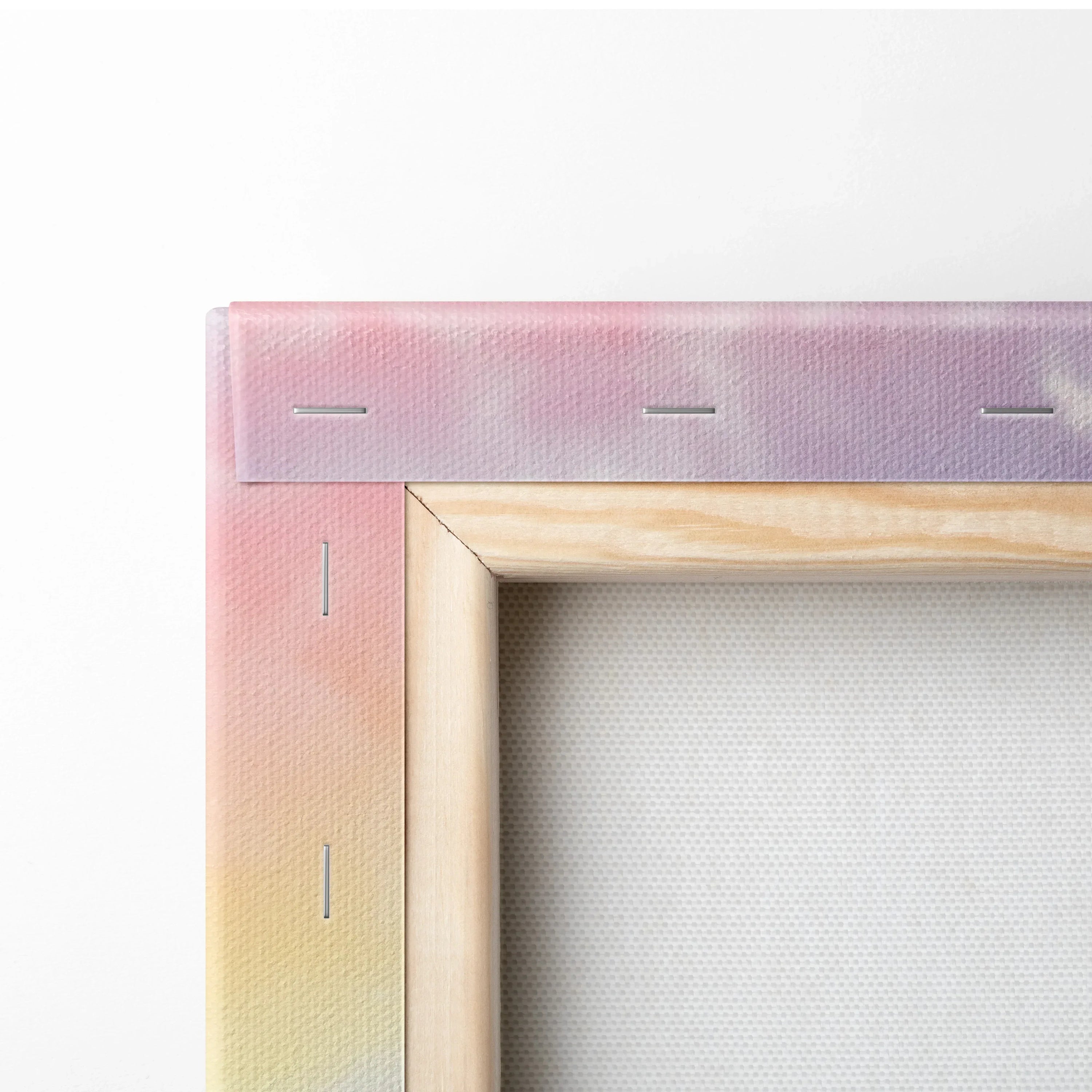 Close-up of canvas wall art corner with natural wood frame and pastel gradient fabric wrap.
