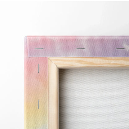 Close-up of canvas wall art corner with natural wood frame and pastel gradient fabric wrap.