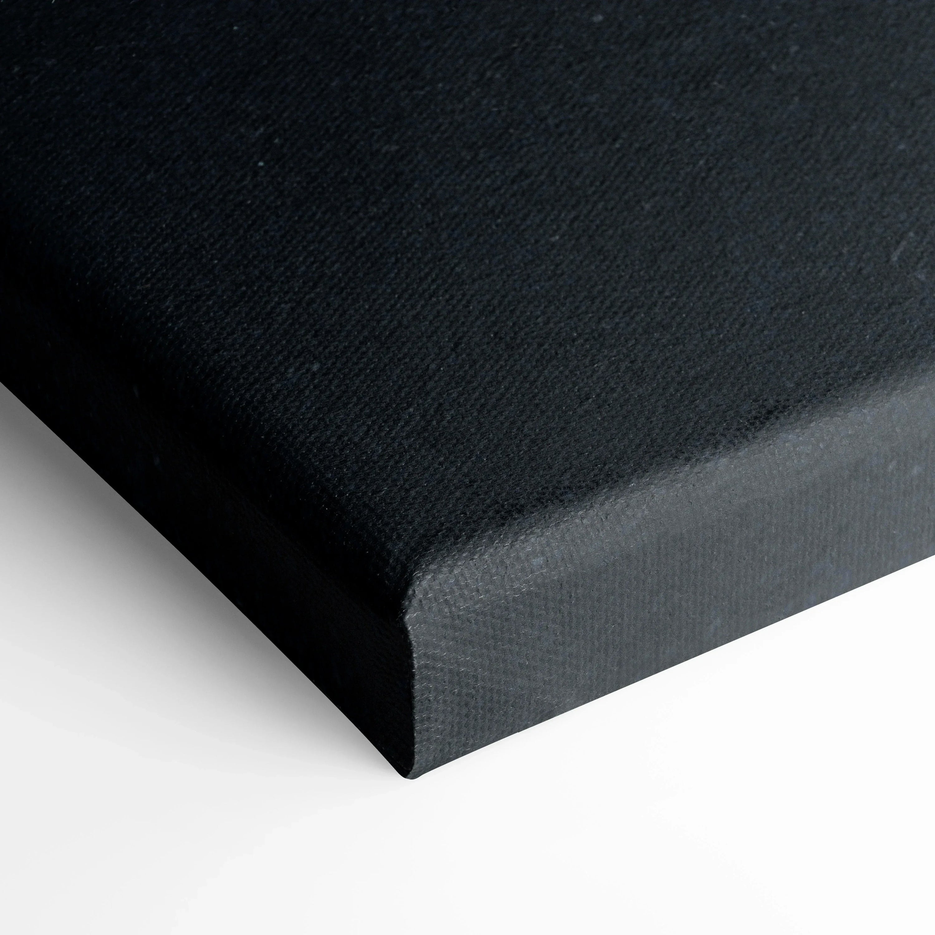 Close-up of black canvas corner with textured surface for wall art print.