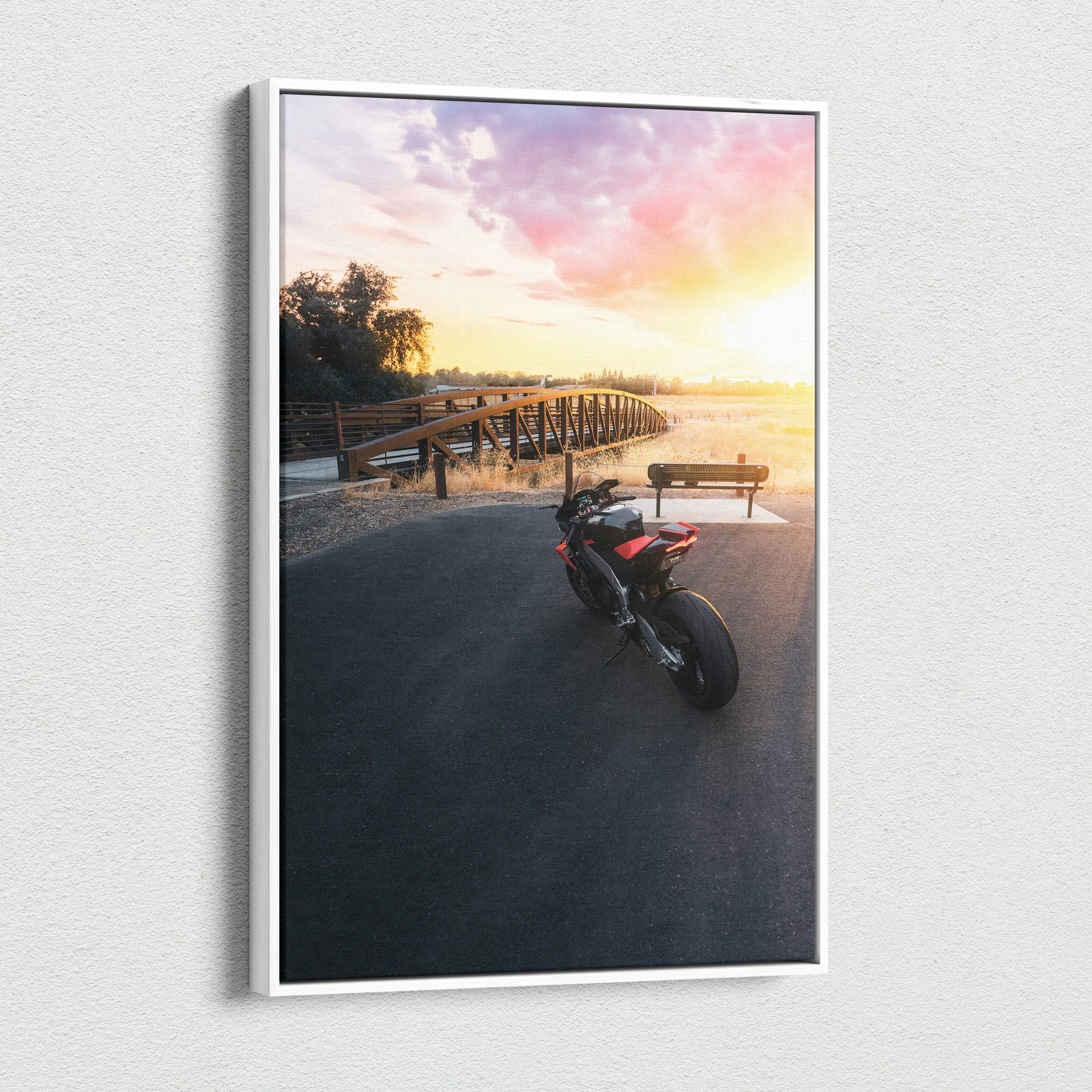 Aprilia RSV4 1100 Factory motorcycle on sunset beach canvas wall art in vertical format.