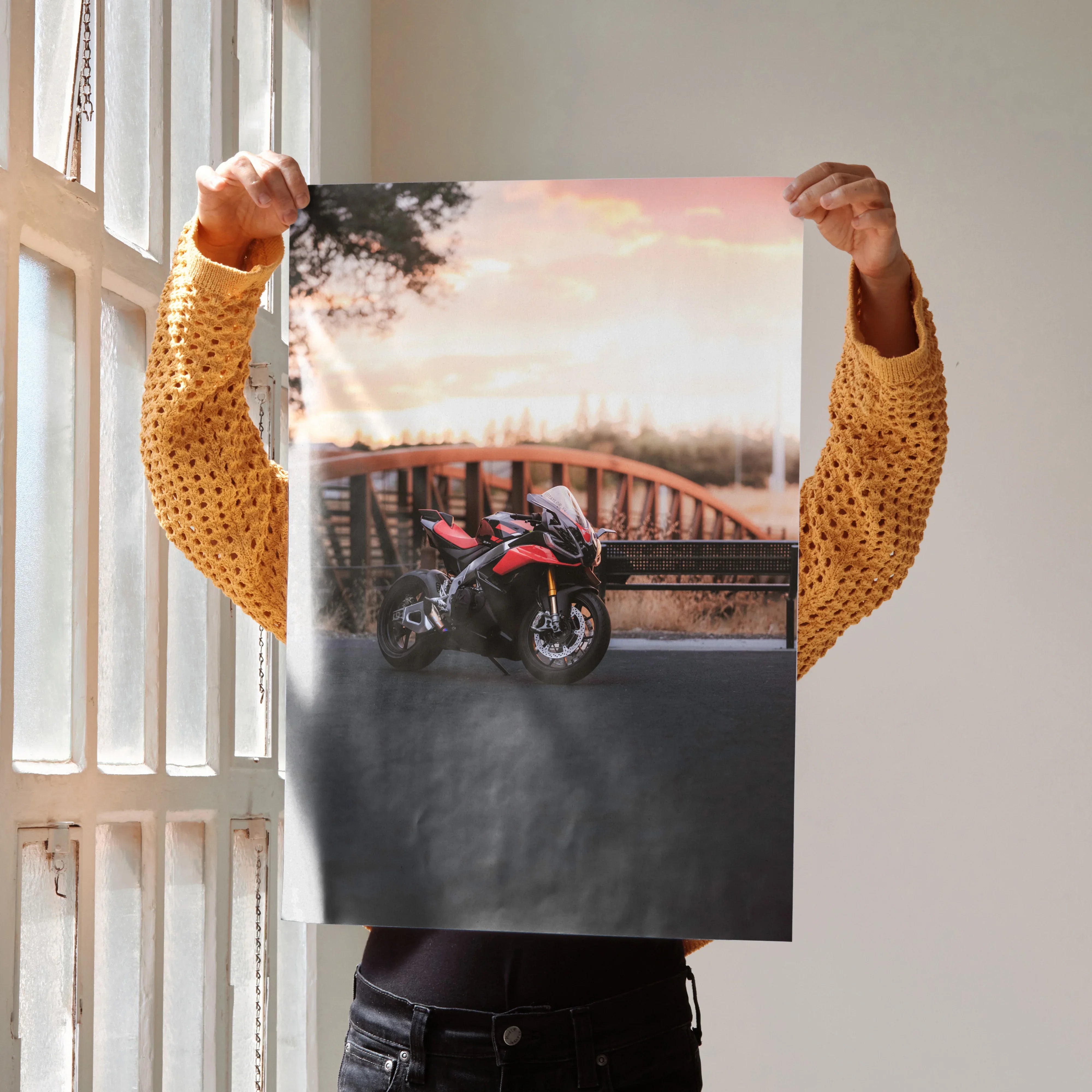 Aprilia RSV4 1100 Factory motorcycle against a sunset sky on a poster wall art.