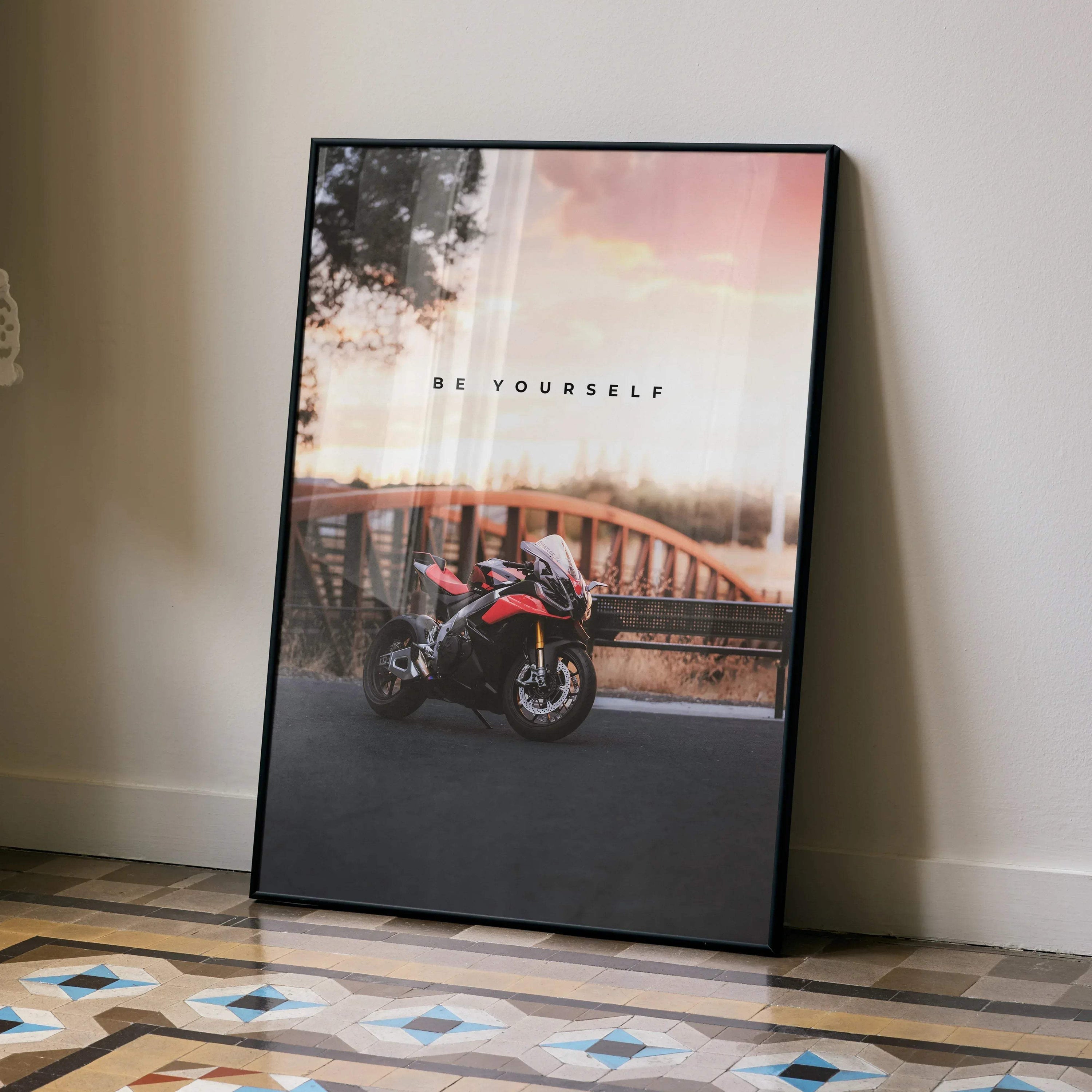 Motivational poster wall art featuring Aprilia RSV4 1100 Factory motorcycle by a bridge at sunset.