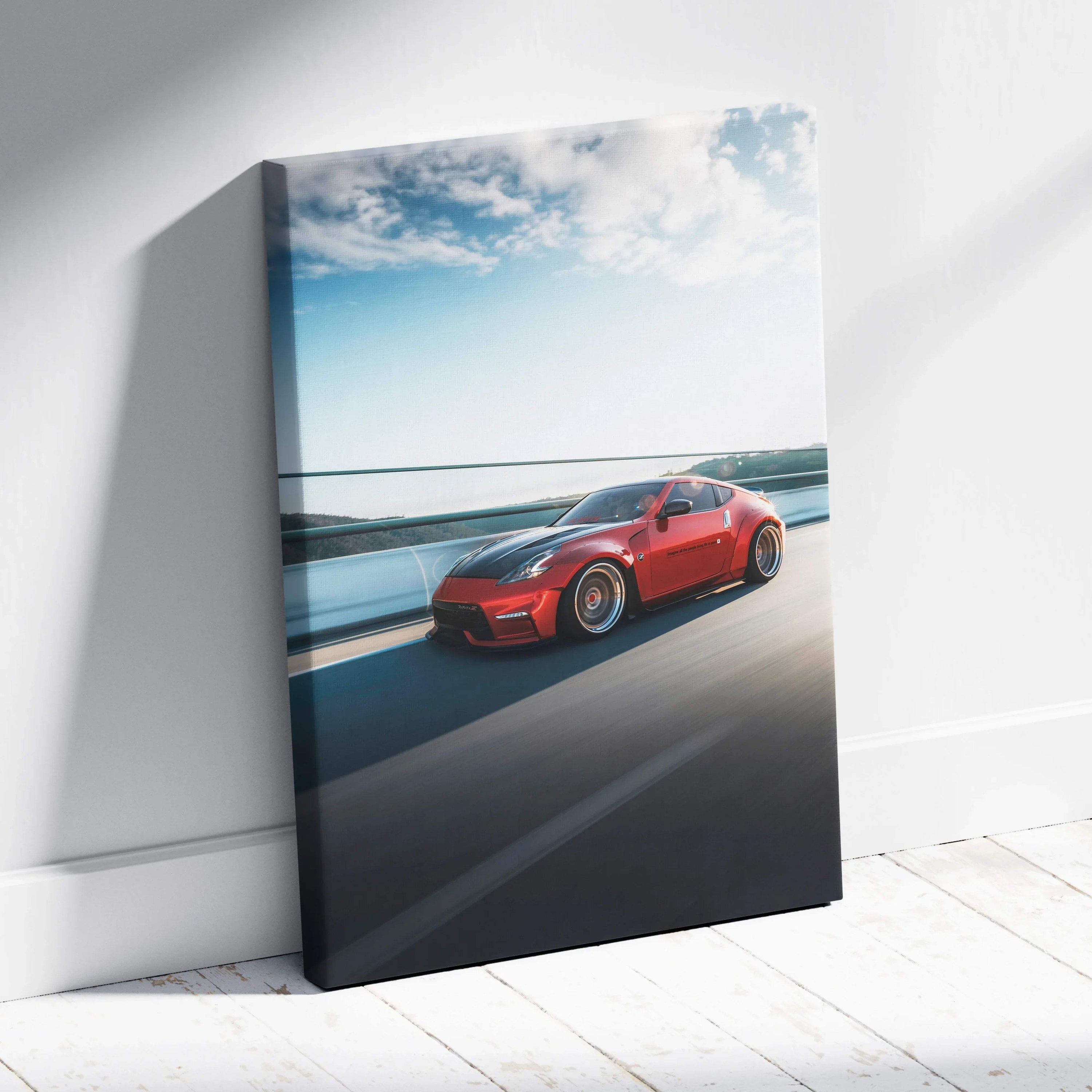 Red Nissan 370z speeding on highway canvas wall art with blue sky background.