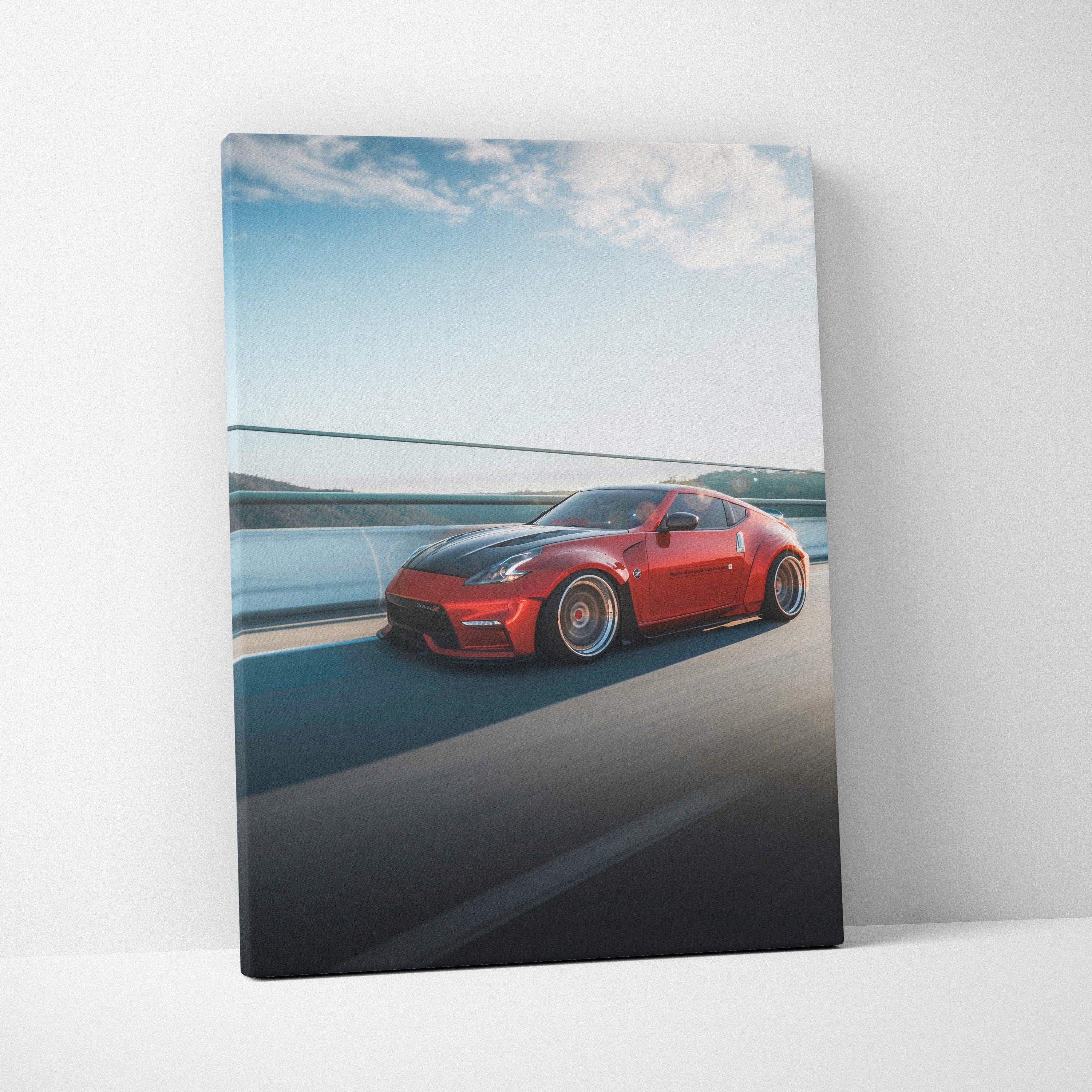 Red Nissan 370z car driving on highway wall art vertical canvas print.