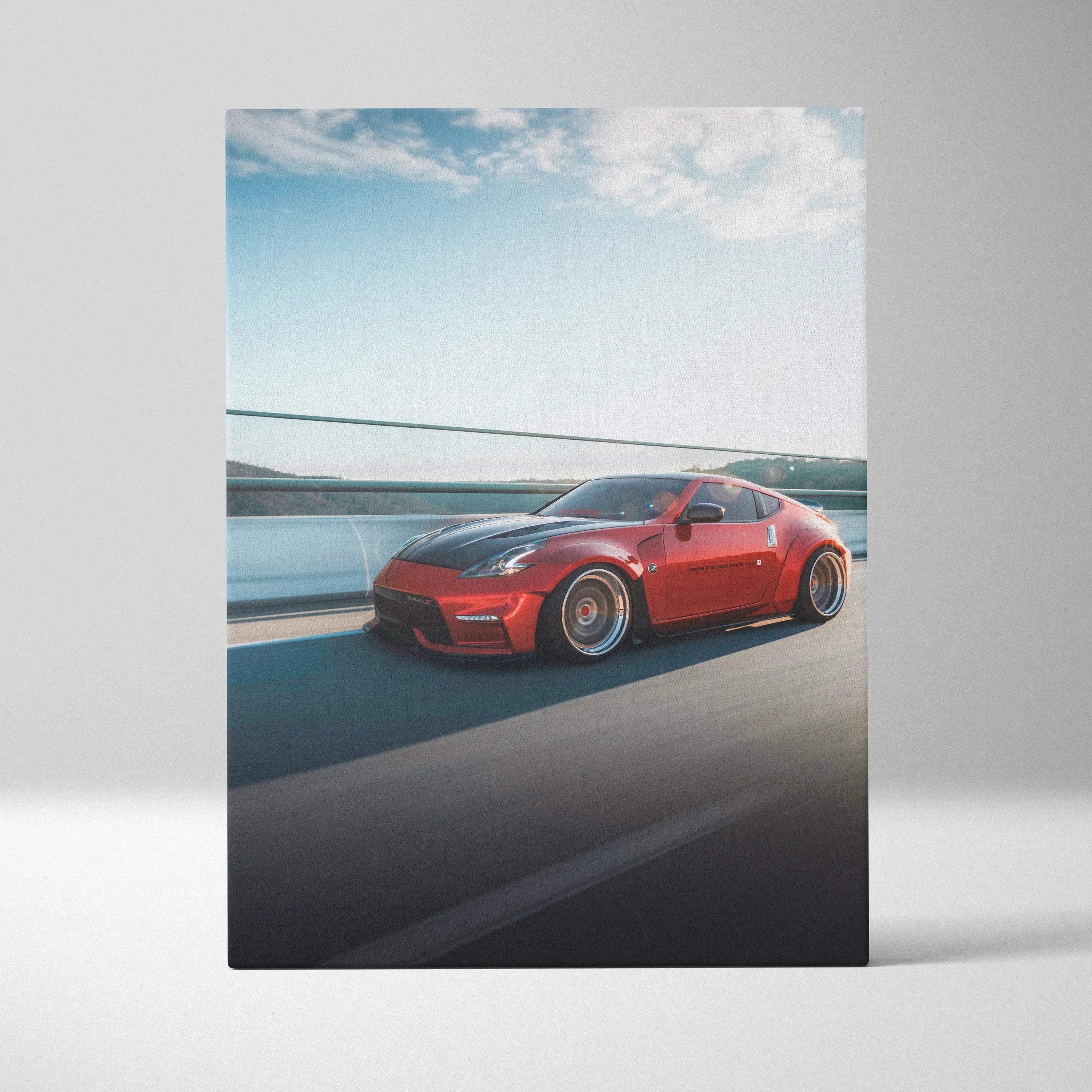 Red Nissan 370z sports car on highway canvas wall art with blue sky background.